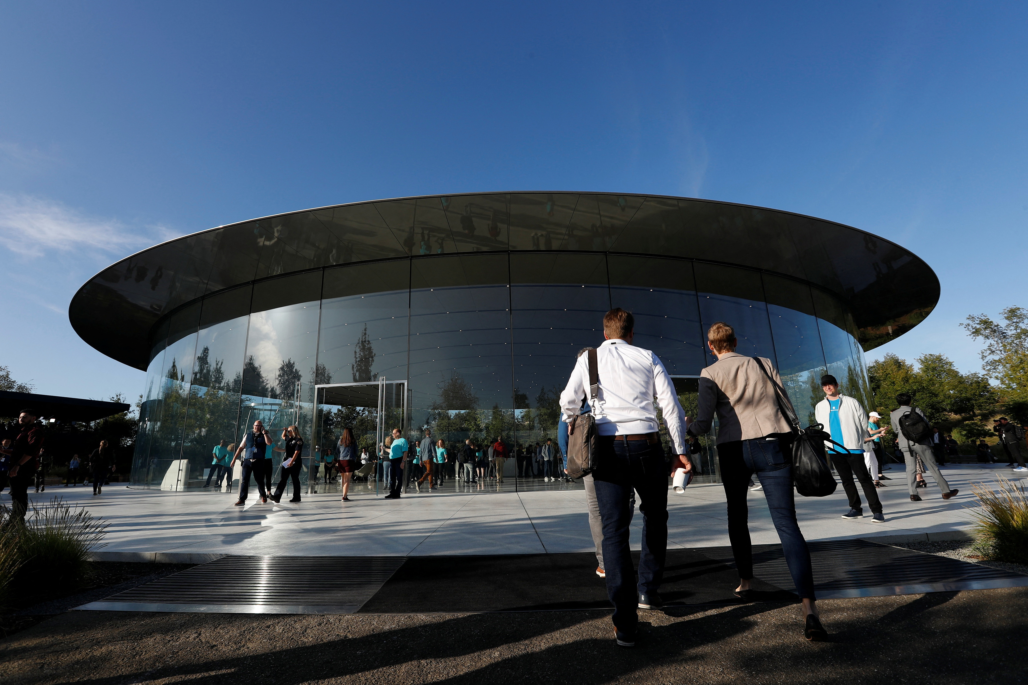 Guests arrive for at the Steve Jobs Theater for an Apple event at their headquarters in Cupertino