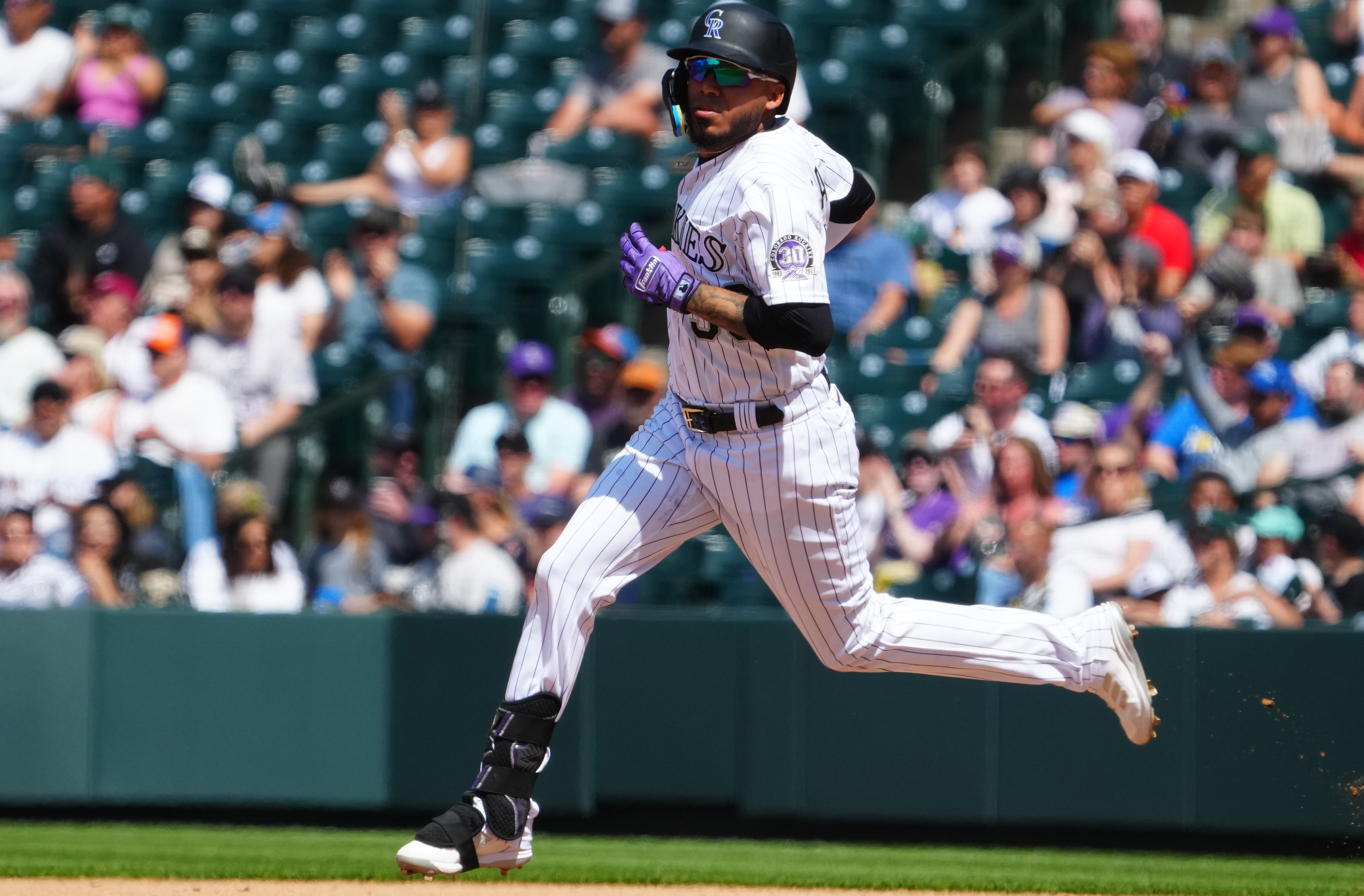 Rockies offense explodes in 12-4 win to avoid sweep