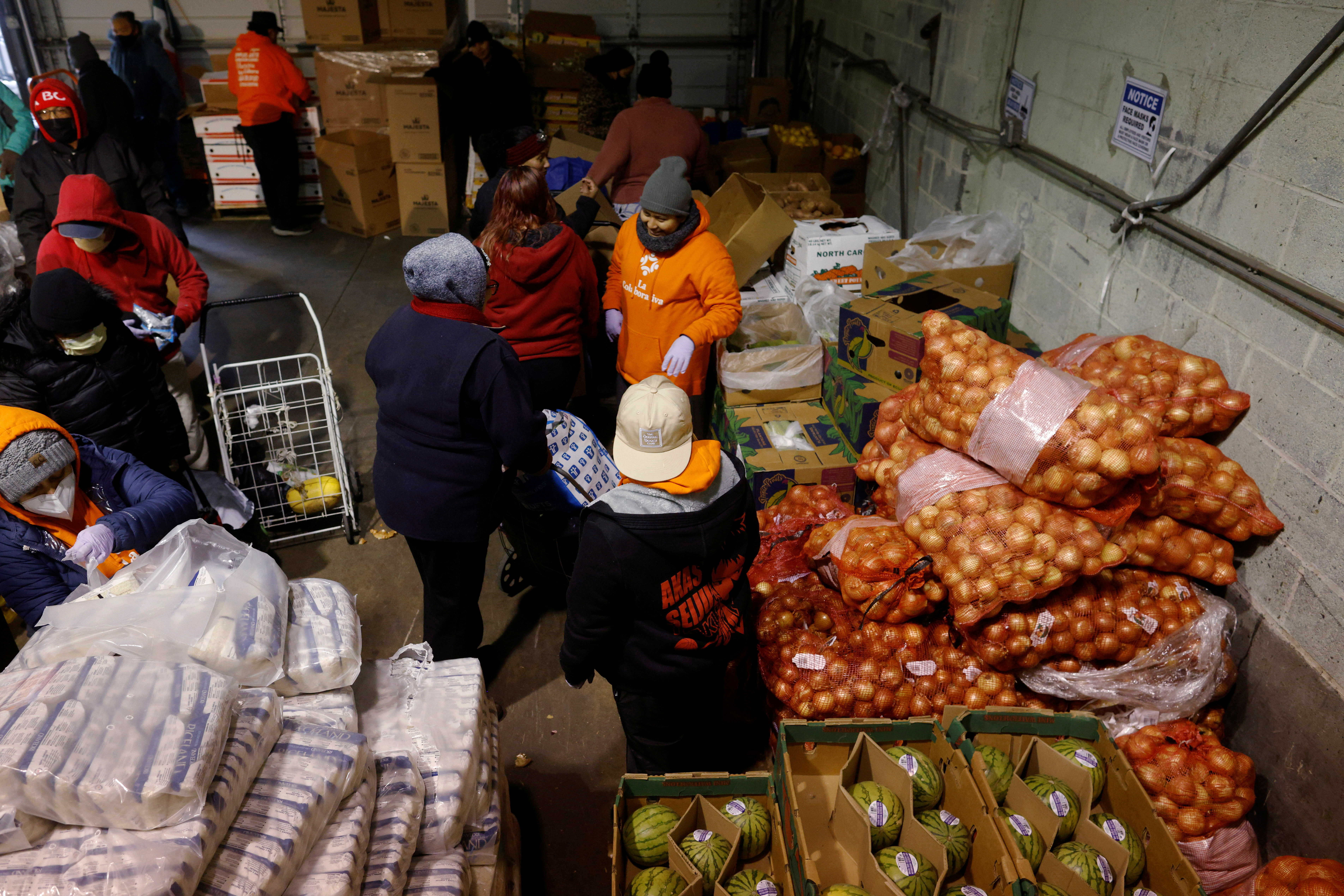 Residents receive free groceries at a food pantry in Chelsea, Massachusetts