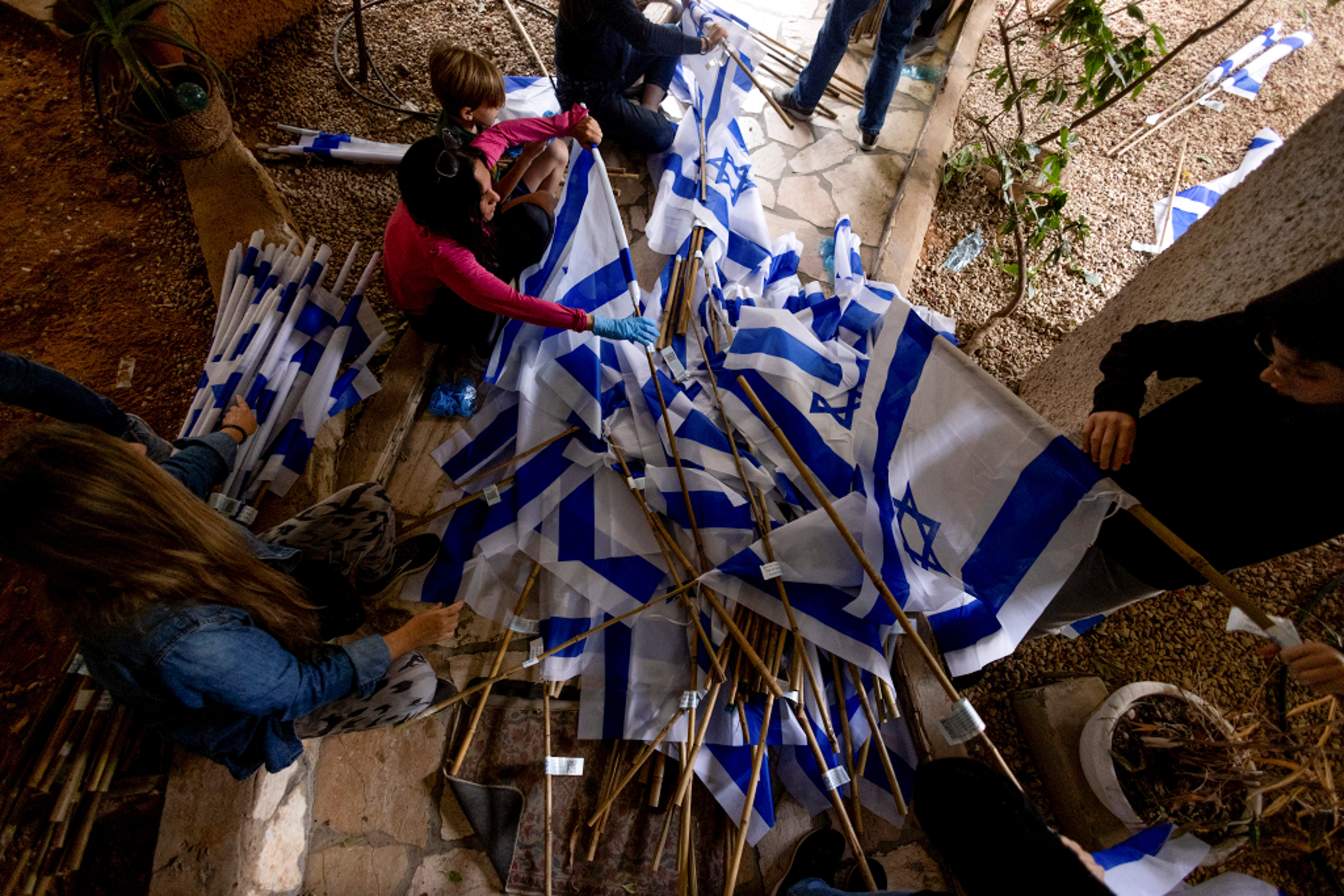 Volunteers work behind the scenes to prepare for Tel Aviv's mass protests