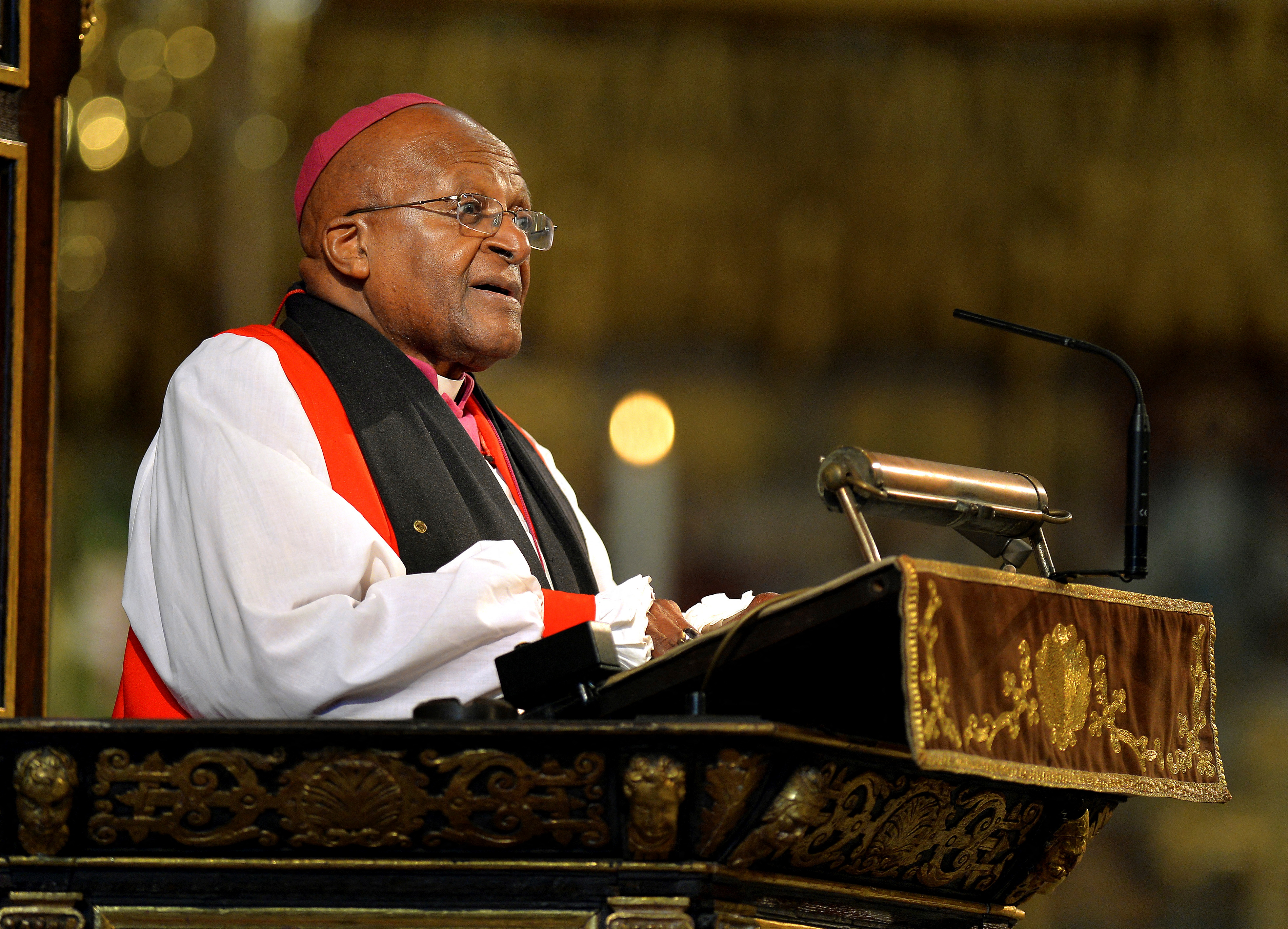 Archbishop Desmond Tutu speaks during a memorial service for former South African President Nelson Mandela at Westminster Abbey in London March 3, 2014. Mandela died on December 5, 2013 at the age of 95. REUTERS/John Stillwell/Pool/File Photo