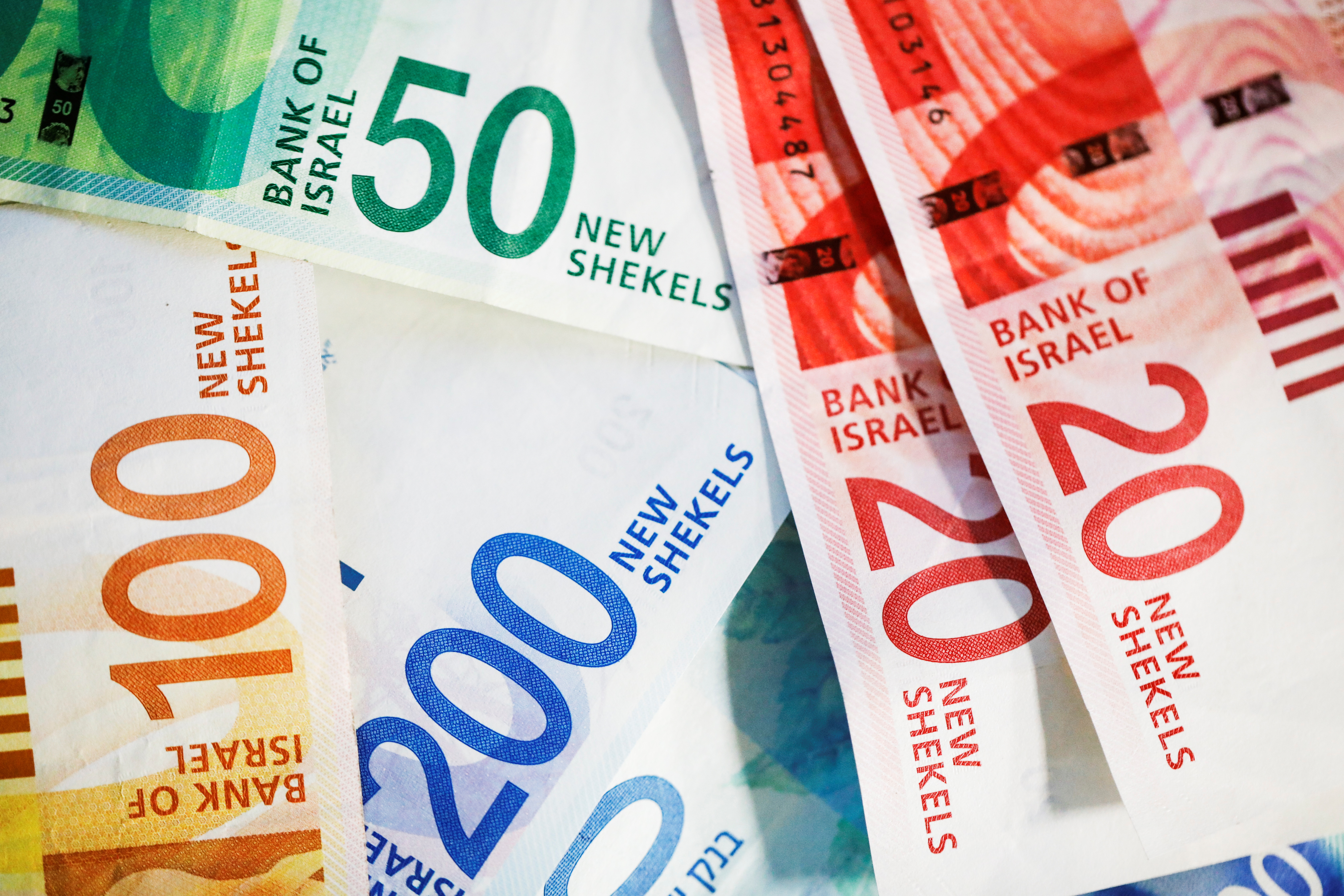New Israeli Shekel banknotes are seen in this picture illustration