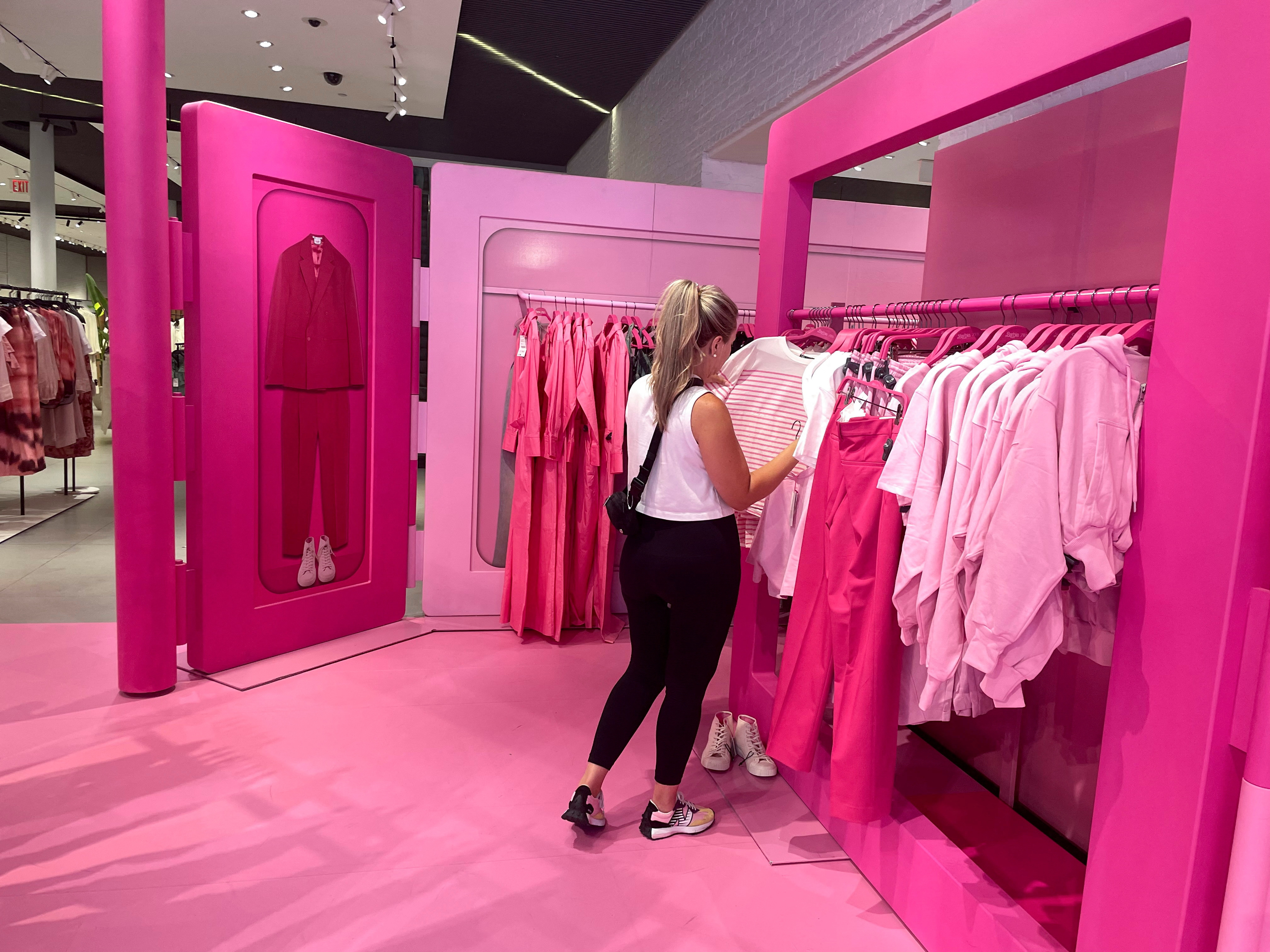 Shoppers browse Barbie-themed merchandise during the Barbie pop-up in Zara's Soho store in New York