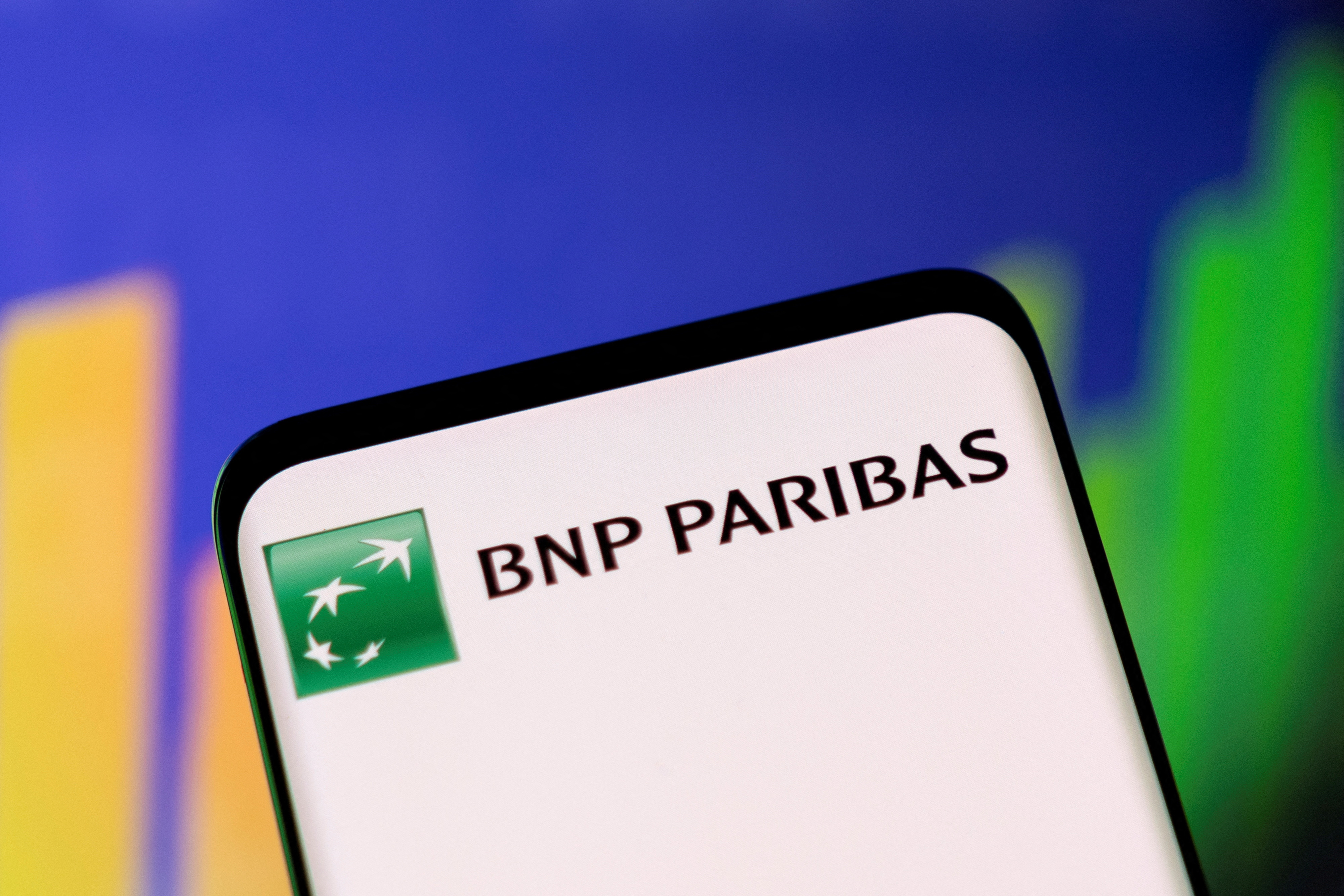 Illustration shows BNP Paribas logo and stock graph