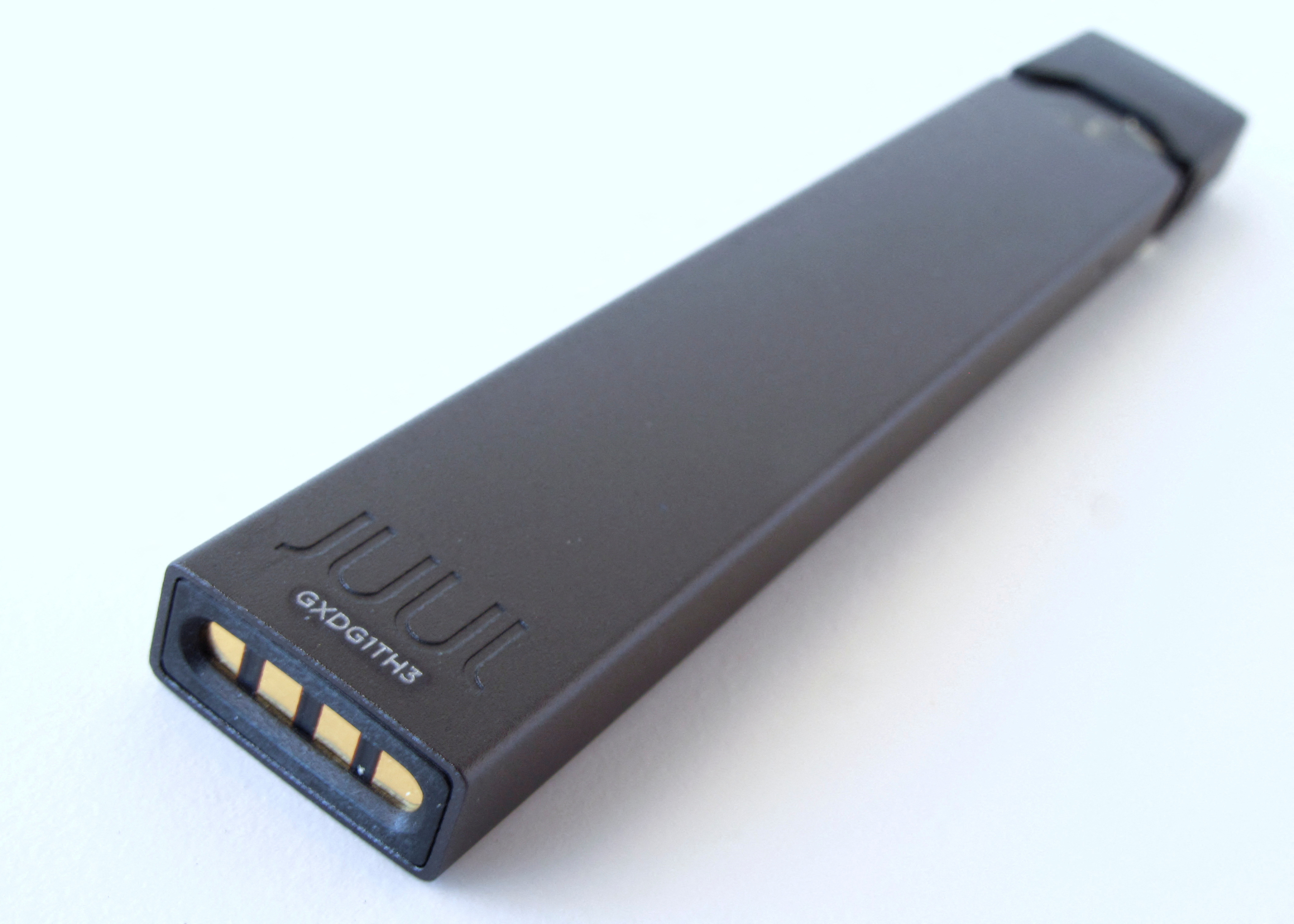 An electronic cigarette device made by JUUL is shown in this picture illustration