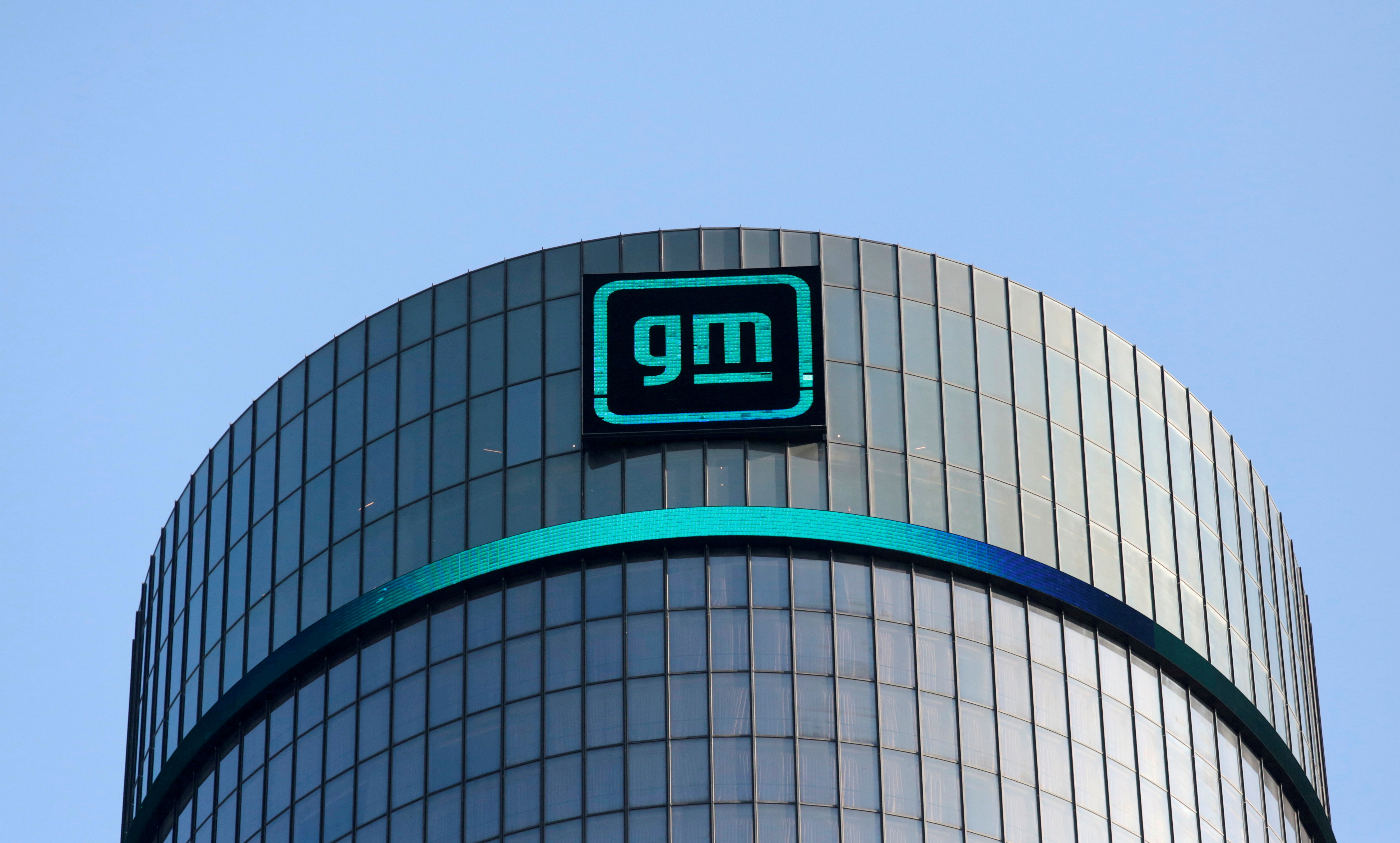 The new GM logo is seen on the facade of the General Motors headquarters in Detroit, Michigan, U.S., March 16, 2021. REUTERS/Rebecca Cook/File Photo