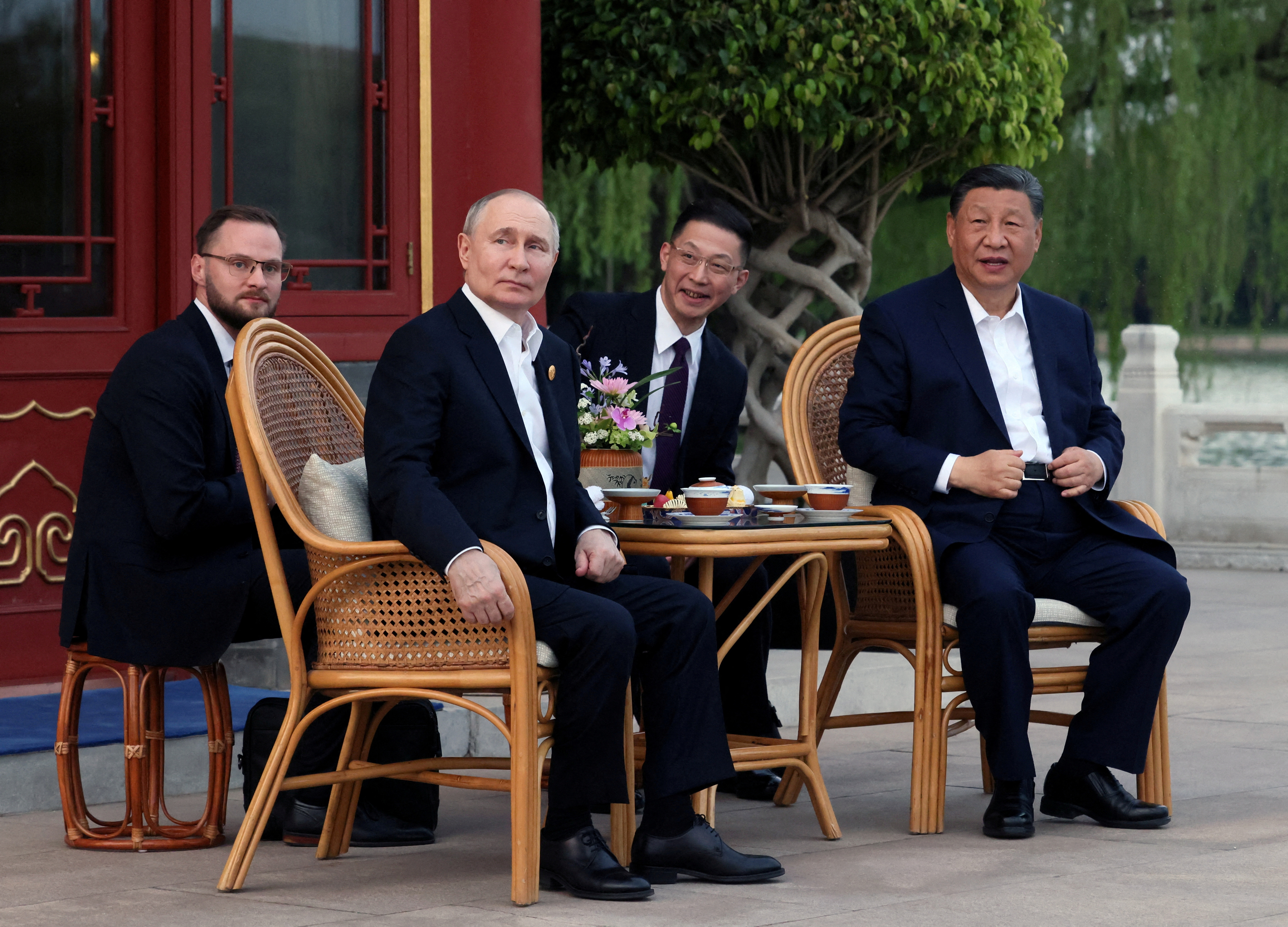 Putin and Xi wrap up talks with tea ceremony in a Beijing park