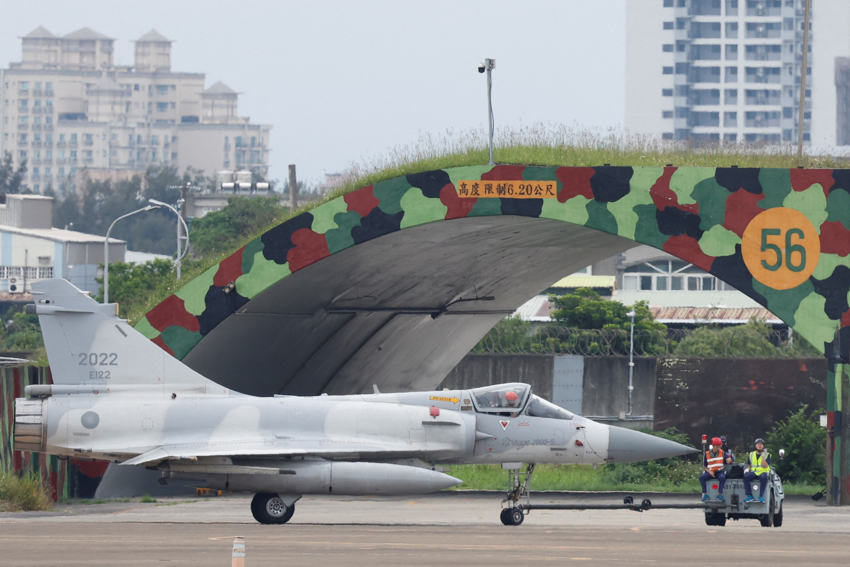 A Taiwan Air Force Mirage 2000-5 aircraft is transported by ground staff at Hsinchu Air Base in Hsinchu