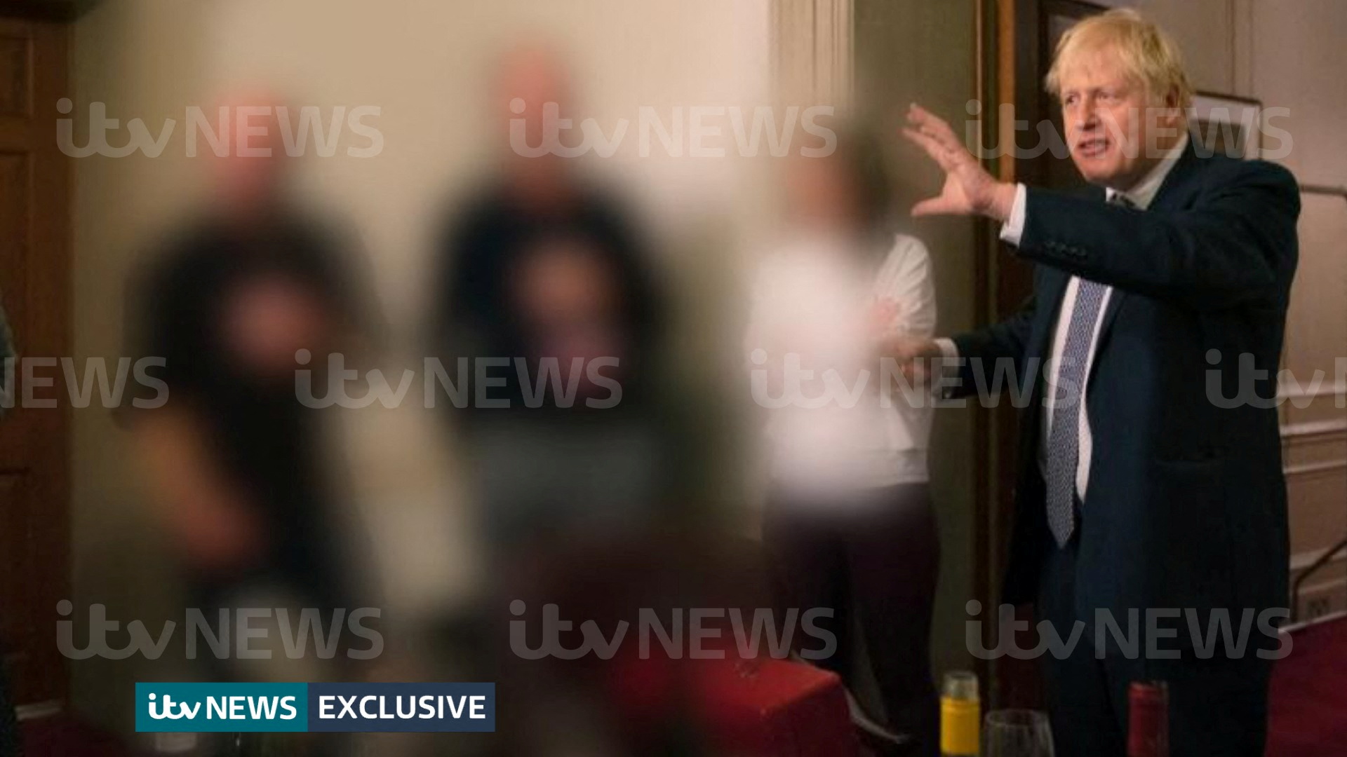 A handout picture shows British Prime Minister Boris Johnson gesturing during a party at Downing Street, amid the coronavirus disease (COVID-19) pandemic in London