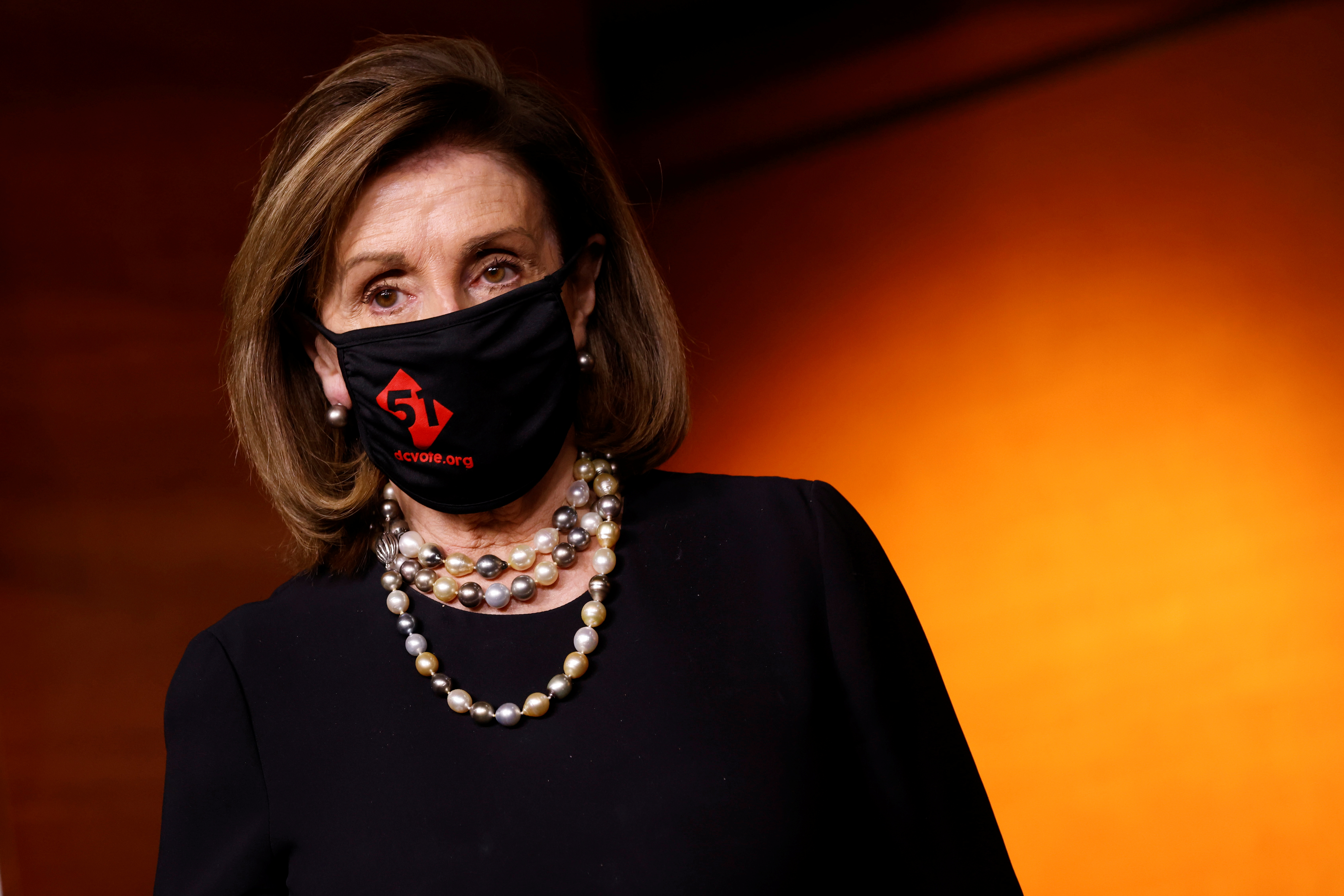 U.S. House Speaker Pelosi wears a mask calling for Washington, D.C., to be made the fifty-first U.S. state, at the U.S. Capitol in Washington