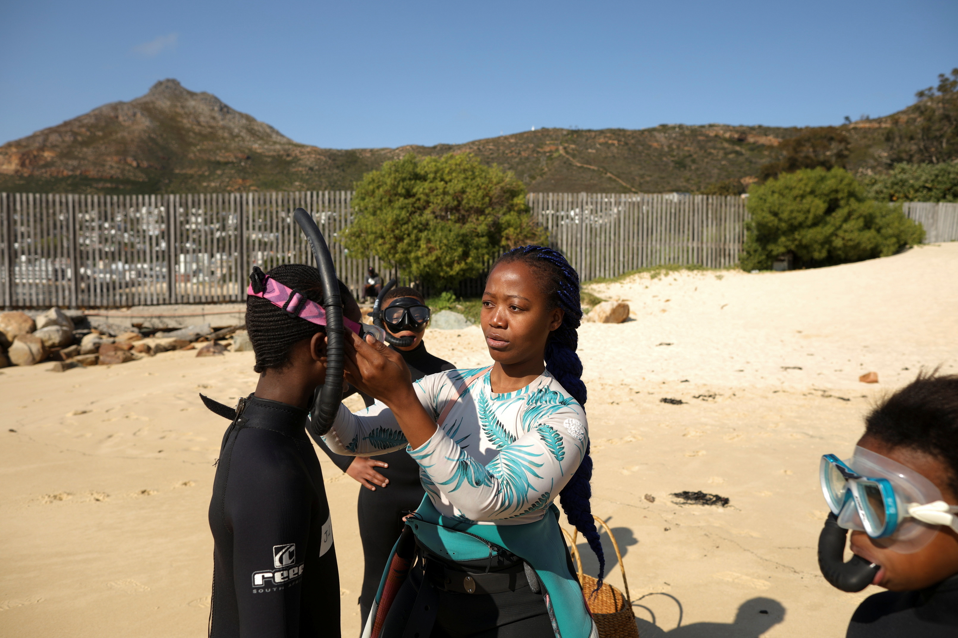 Free diver Zandile Ndlovu helps township youth preparing to explore the marine world off Simonstown