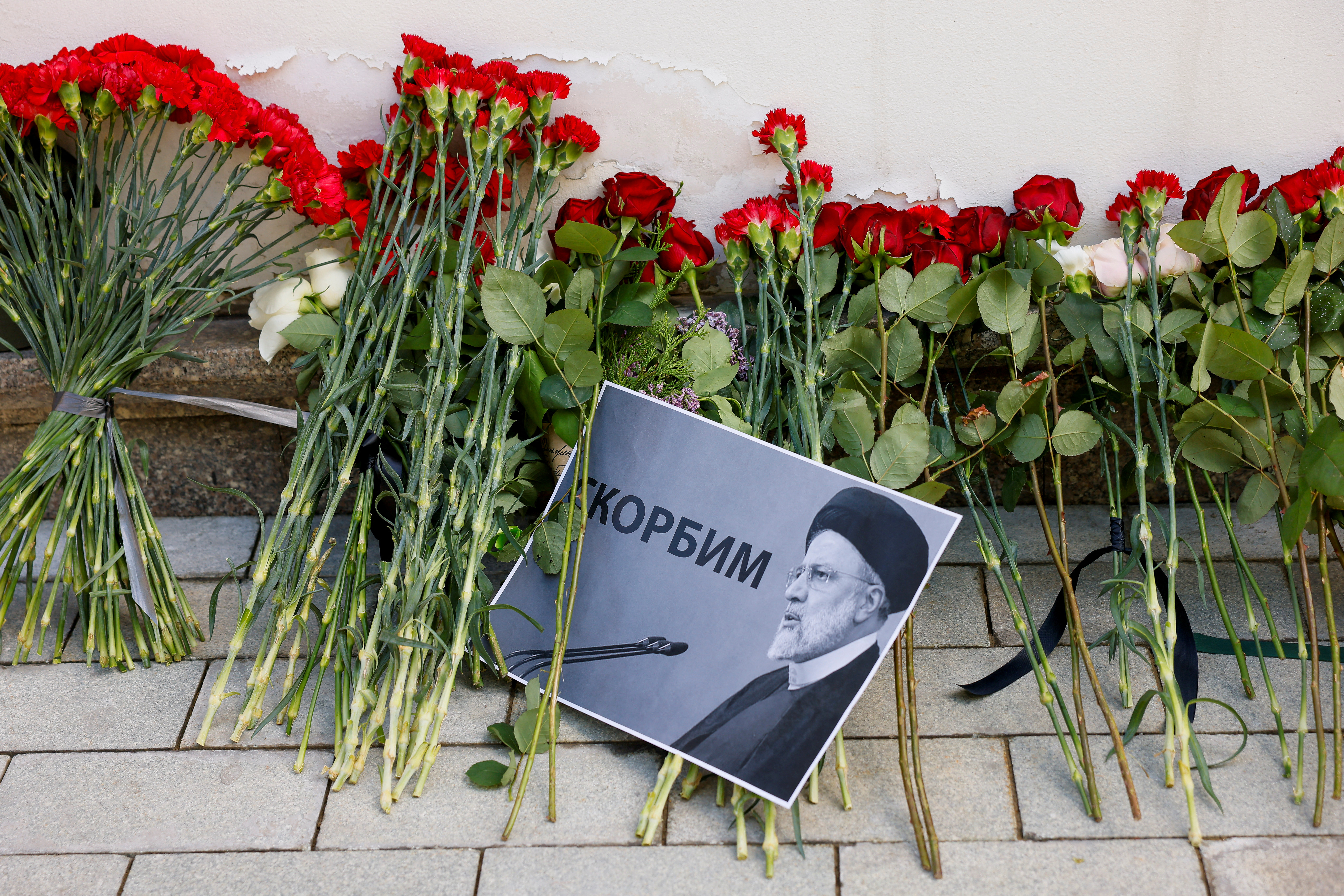 People come to Iranian embassy to pay tribute to President Raisi and other helicopter crash victims, in Moscow