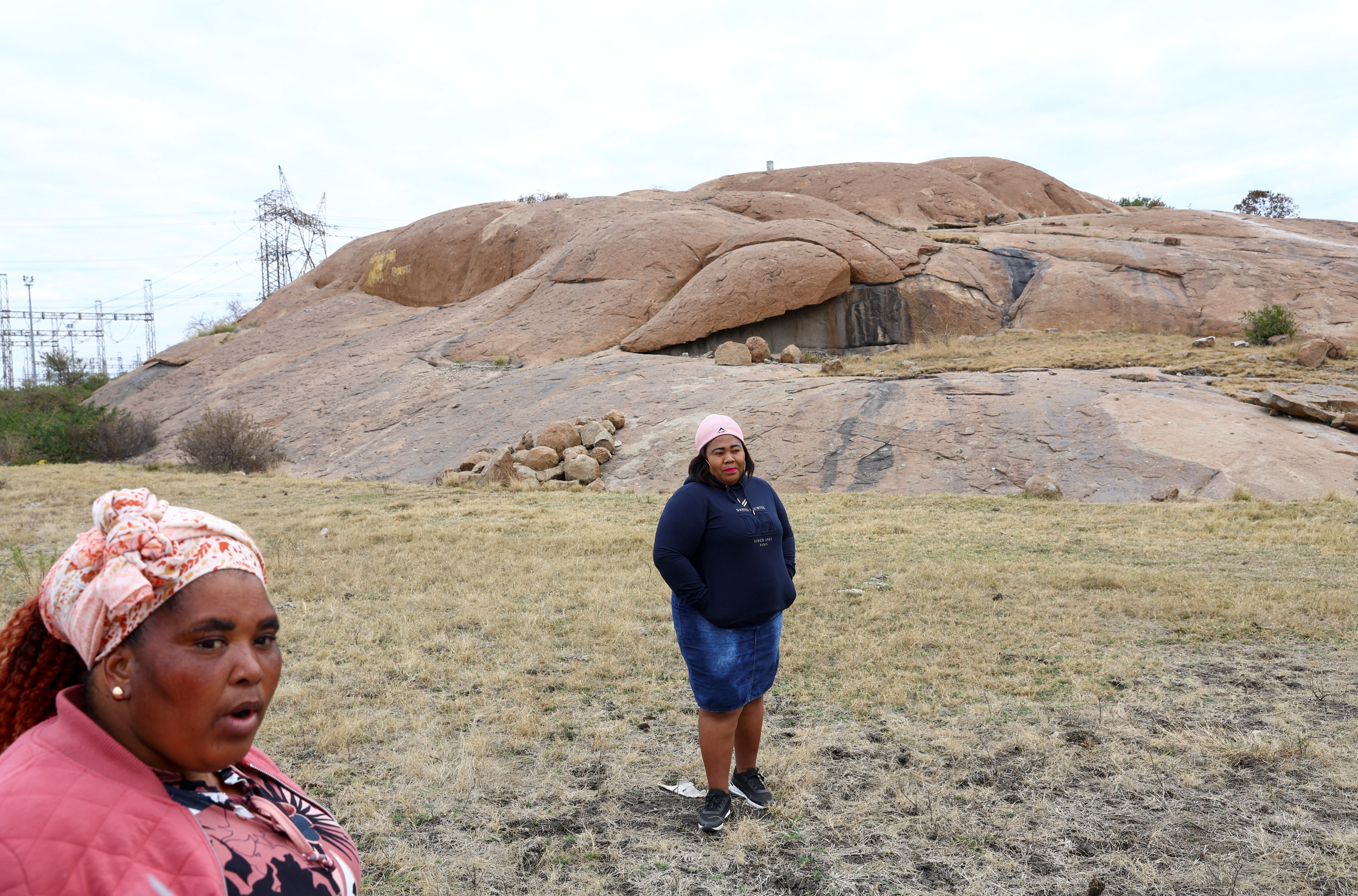 Zameka Nungu and Nosihle Ngweyi, two widows who lost their husbands during the brutal killing of miners, speak near the Lonmin mine in Rustenburg