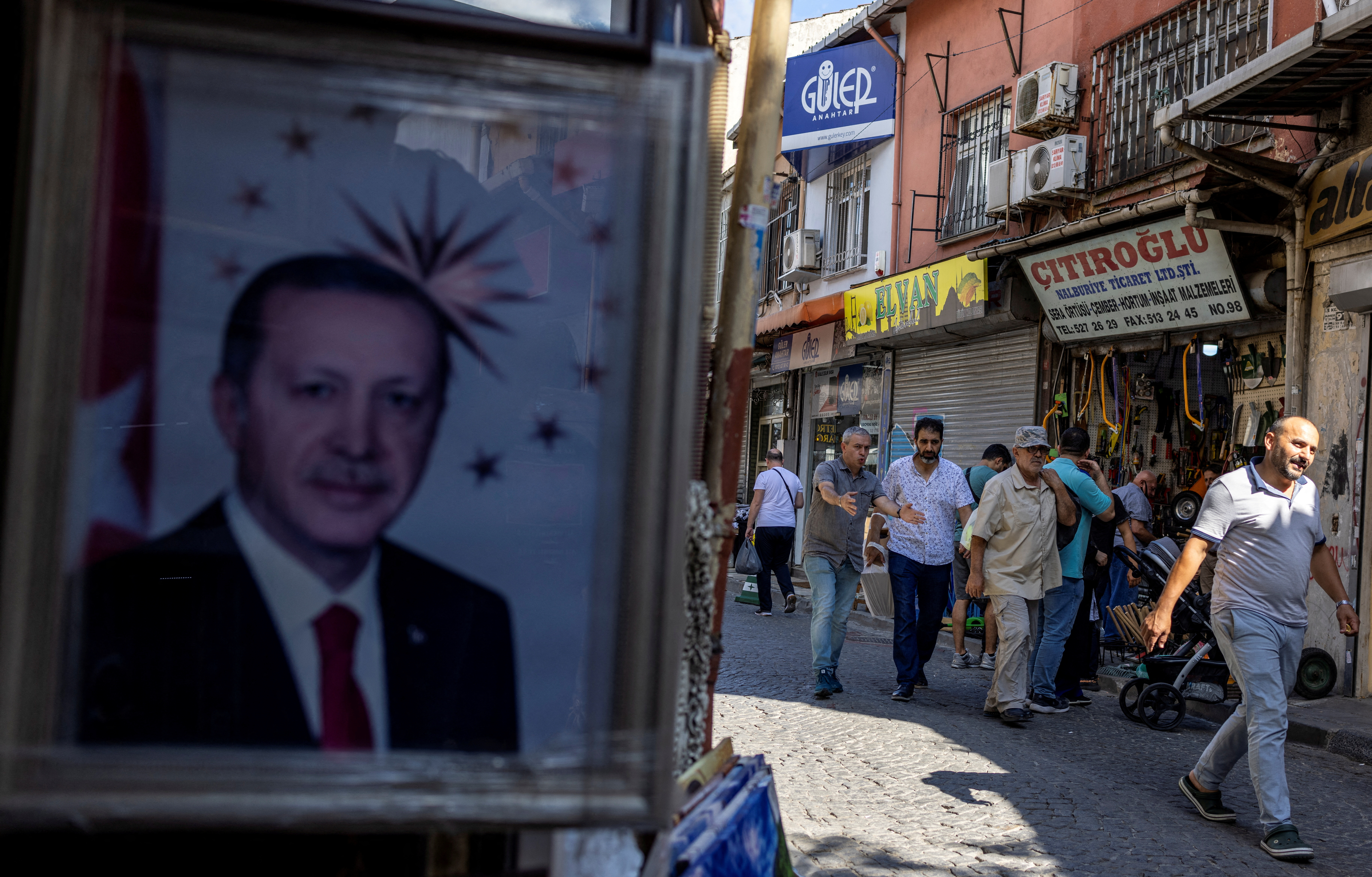 A portrait of Turkish President Tayyip Erdogan is seen at the entrance of a shop, in Istanbul