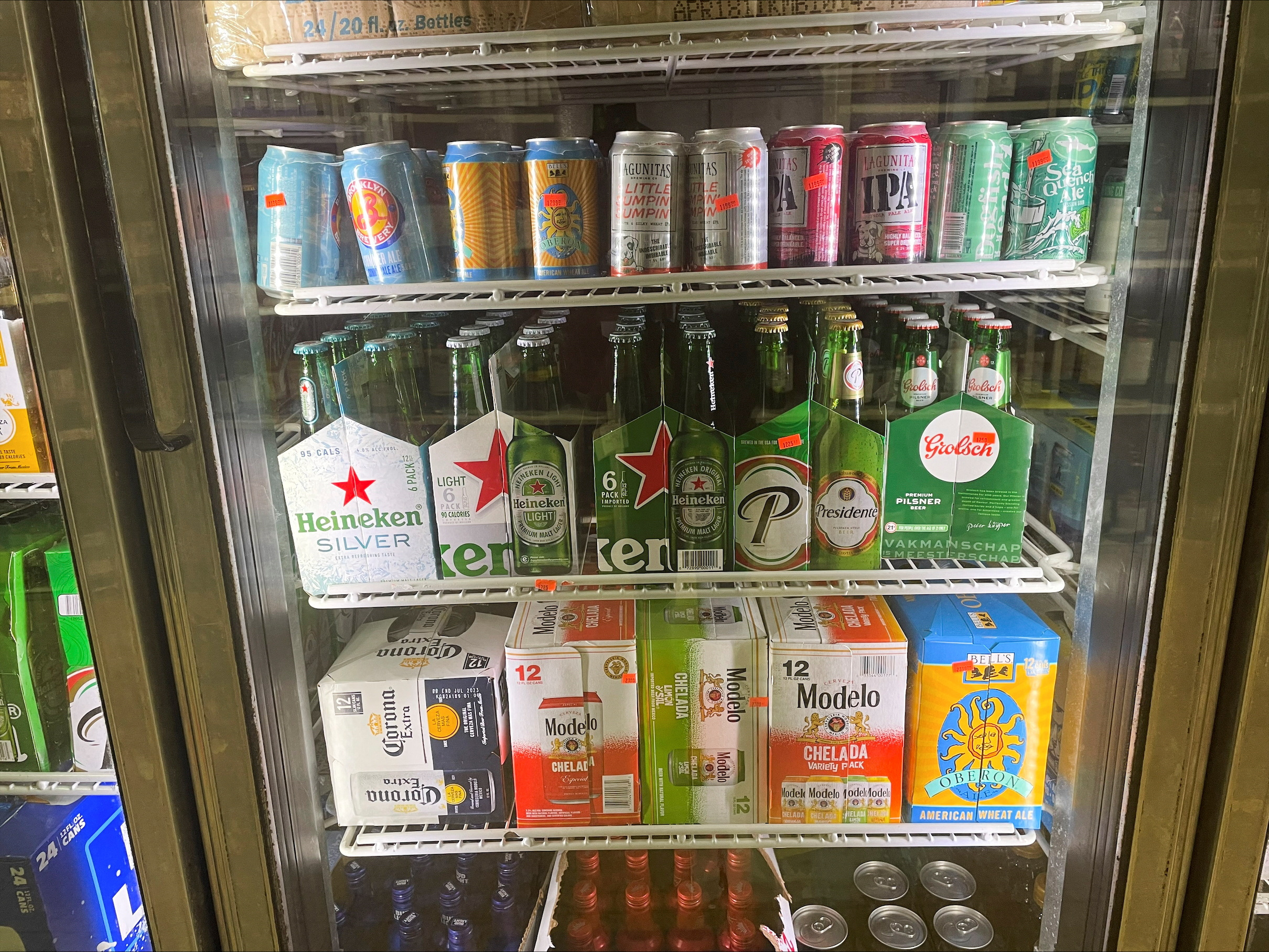 Bottles of Heineken Silver are seen in a fridge among other beers at convenience store in Jersey City