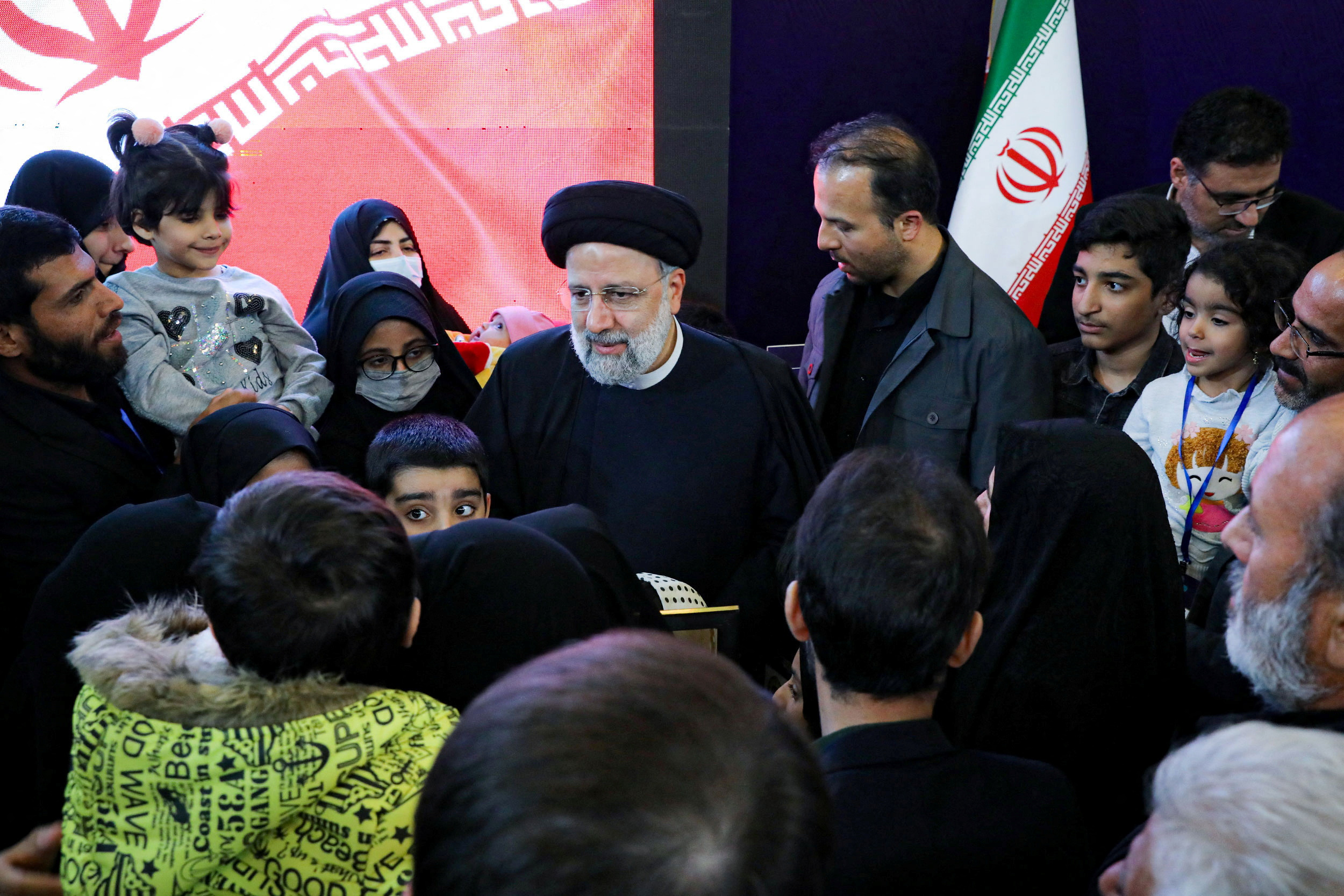 Iranian President Ebrahim Raisi meets with the families of security forces killed during Iran's protests, in Tehran
