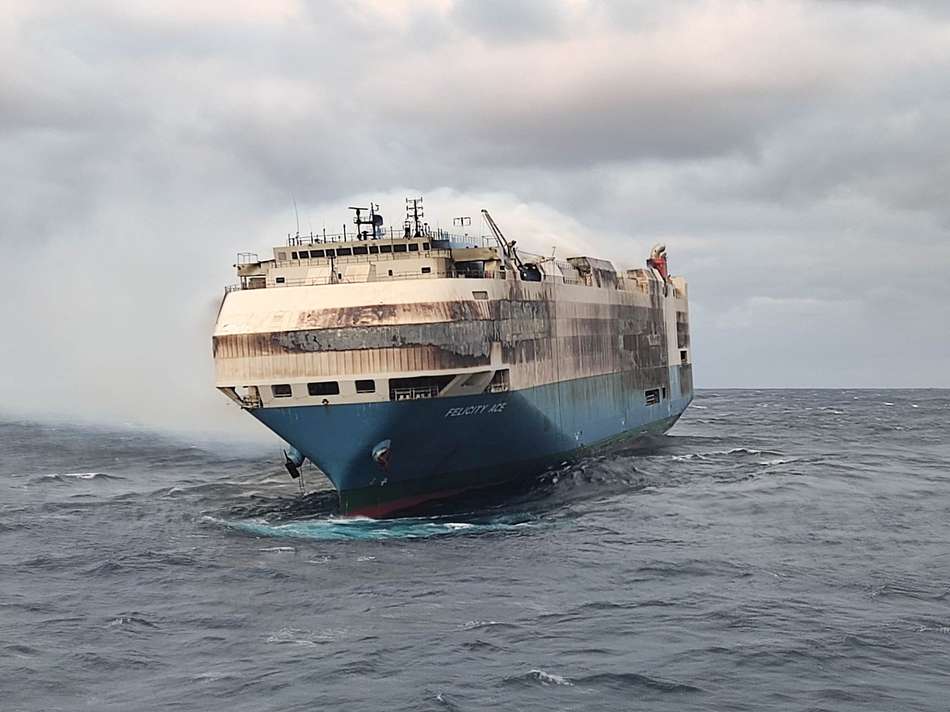 The ship, Felicity Ace, which was traveling from Emden, Germany, where Volkswagen has a factory, to Davisville, in the U.S. state of Rhode Island, burns more than 100 km from the Azores islands, Portugal, February 18, 2022. Portuguese Navy (Marinha Portuguesa)/Handout via REUTERS