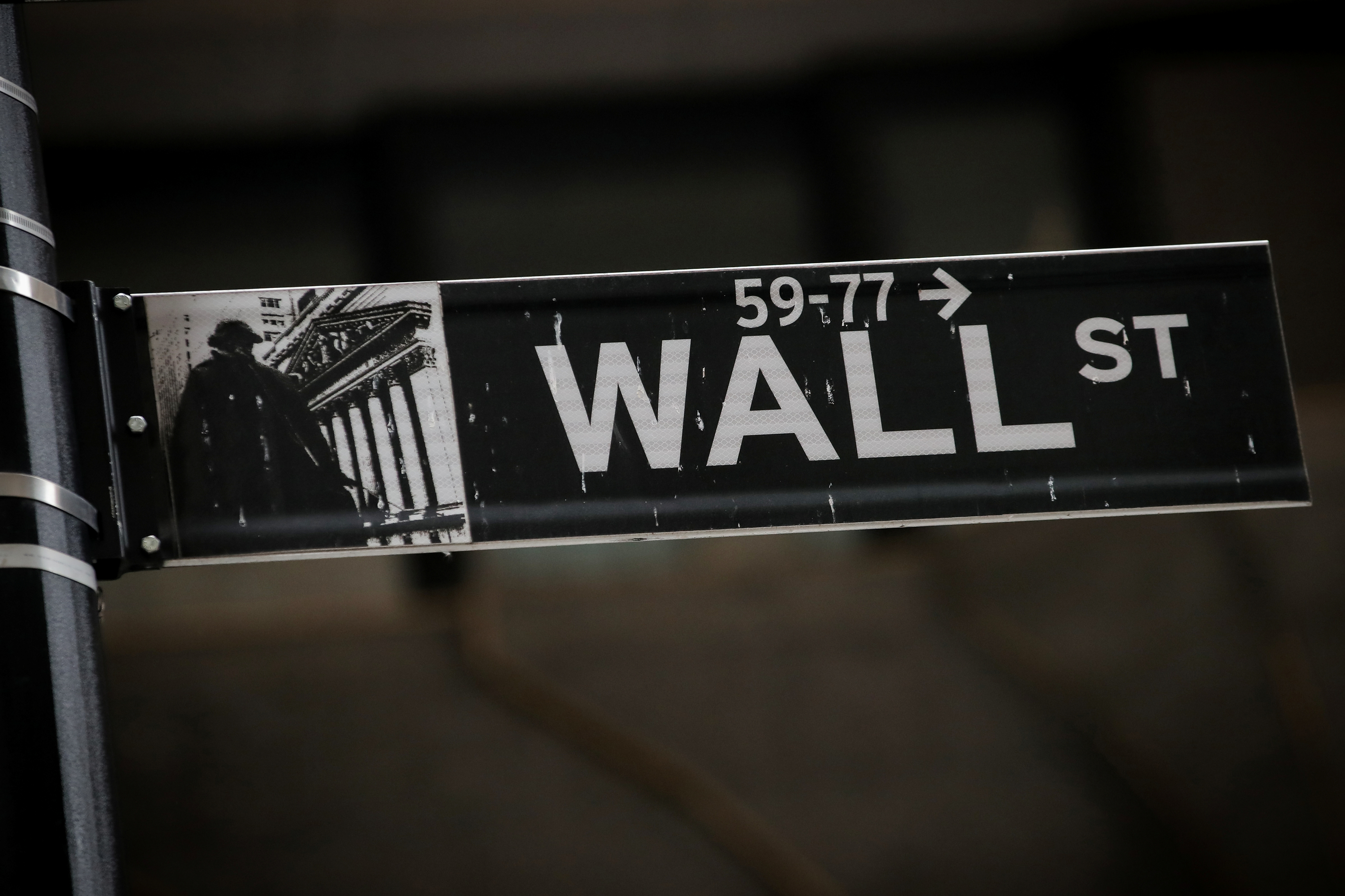 A Wall St. street sign is seen near the New York Stock Exchange (NYSE) in New York