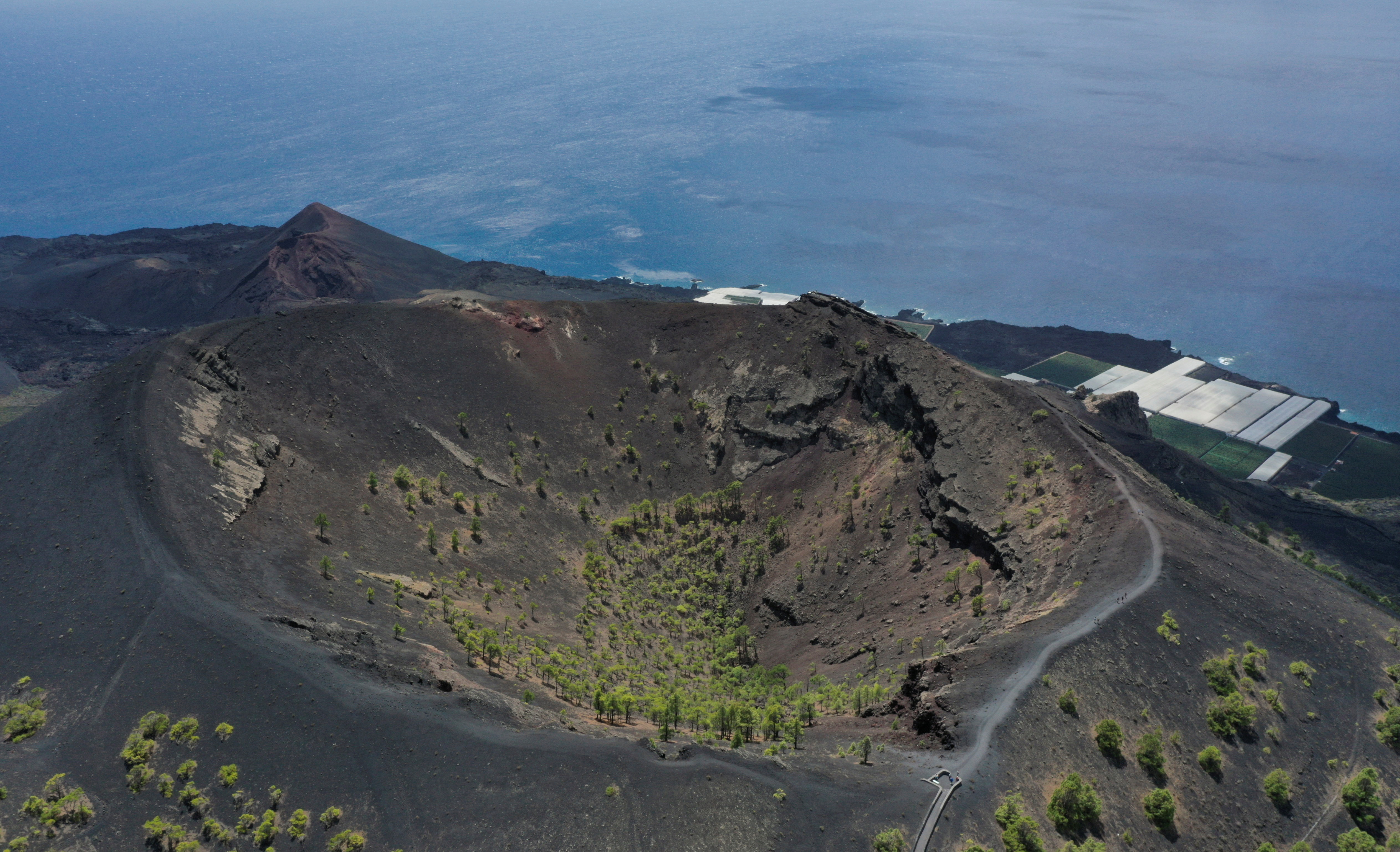 An aerial view of San Antonio Volcano in the foreground and Teneguia Volcano in the background on the Canary Island of La Palma