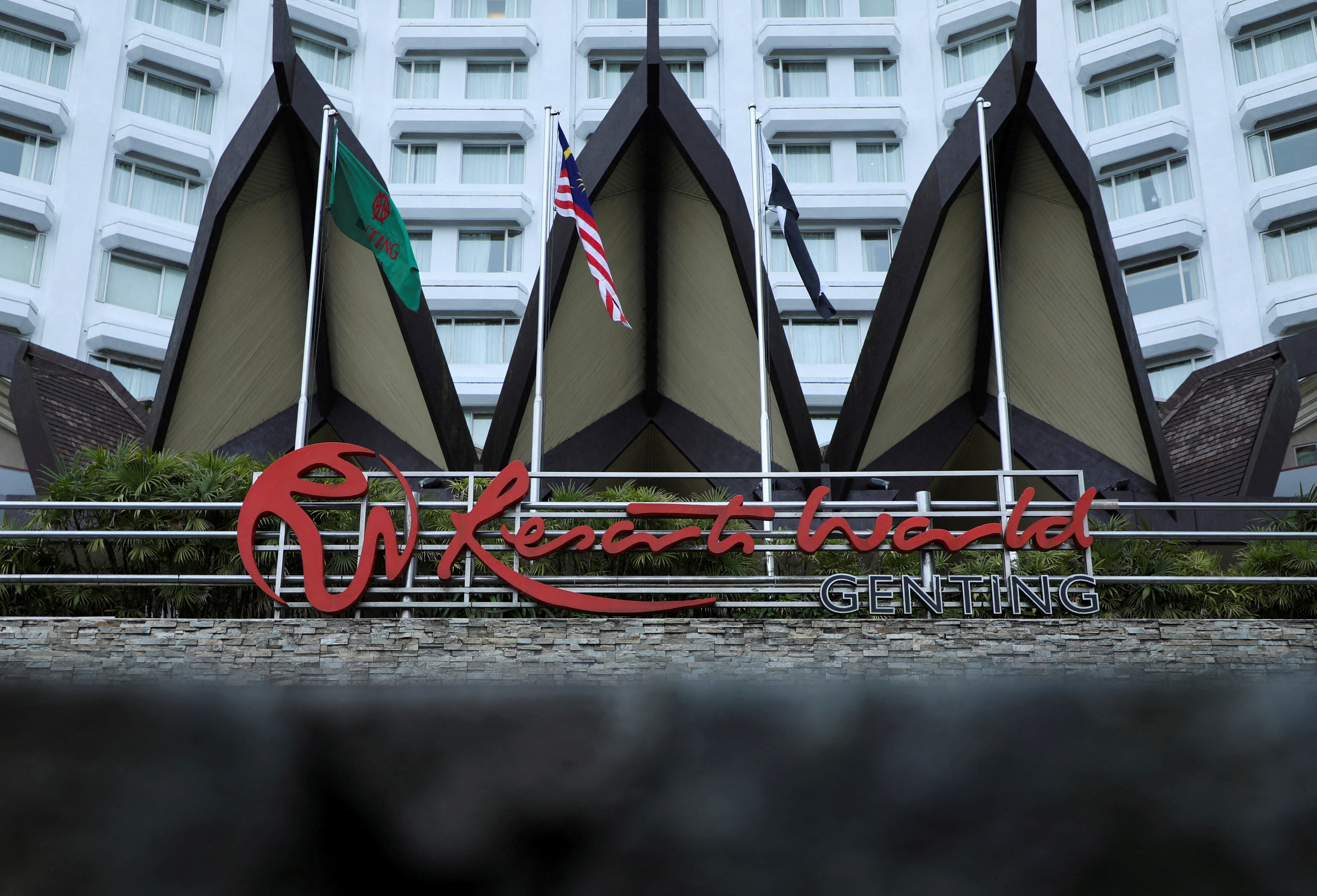 Signage of Genting Malaysia’s Resorts World is displayed at its complex of casino, hotel and entertainment park in Genting Highlands