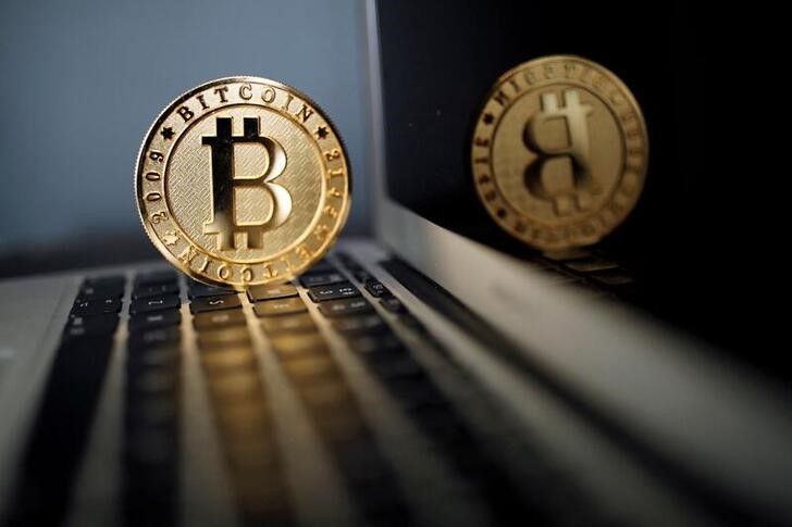 A bitcoin representation is seen in an illustration picture taken at La Maison du Bitcoin in Paris