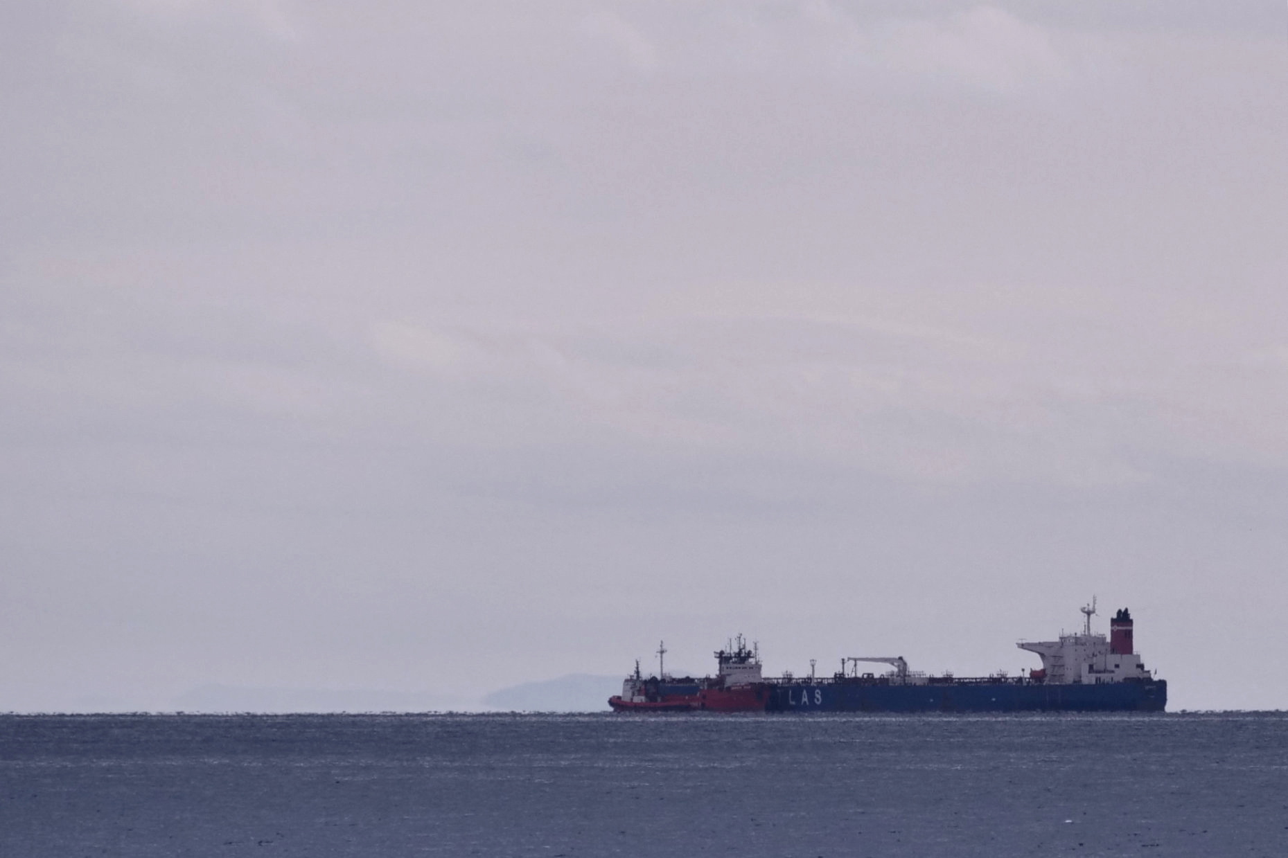 The seized Russian-flagged oil tanker Pegas is seen anchored off the shore of Karystos, on the Island of Evia