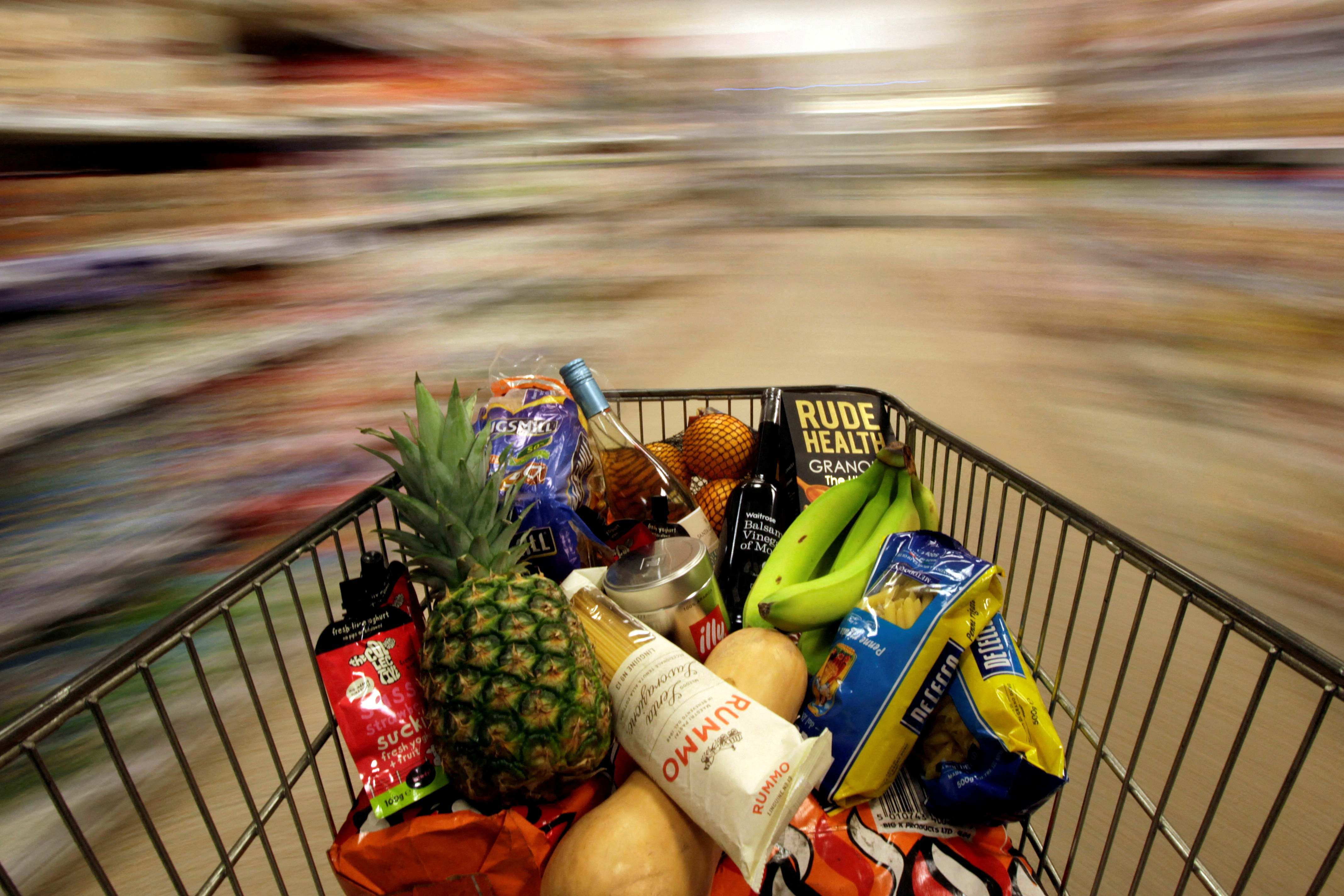 A shopping trolley is pushed around a supermarket in London
