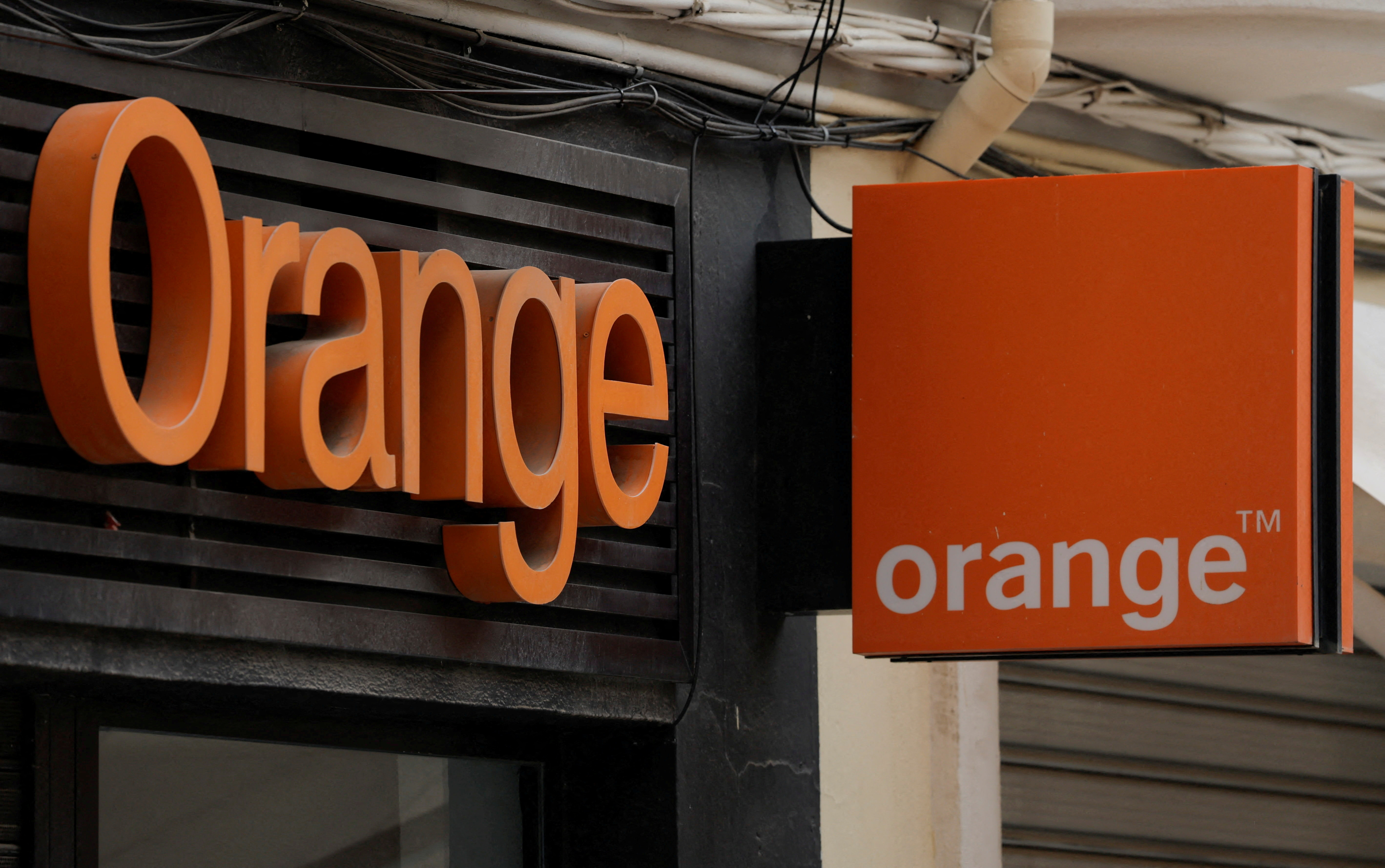 The logo of Orange is seen on the facade of a store in Ronda