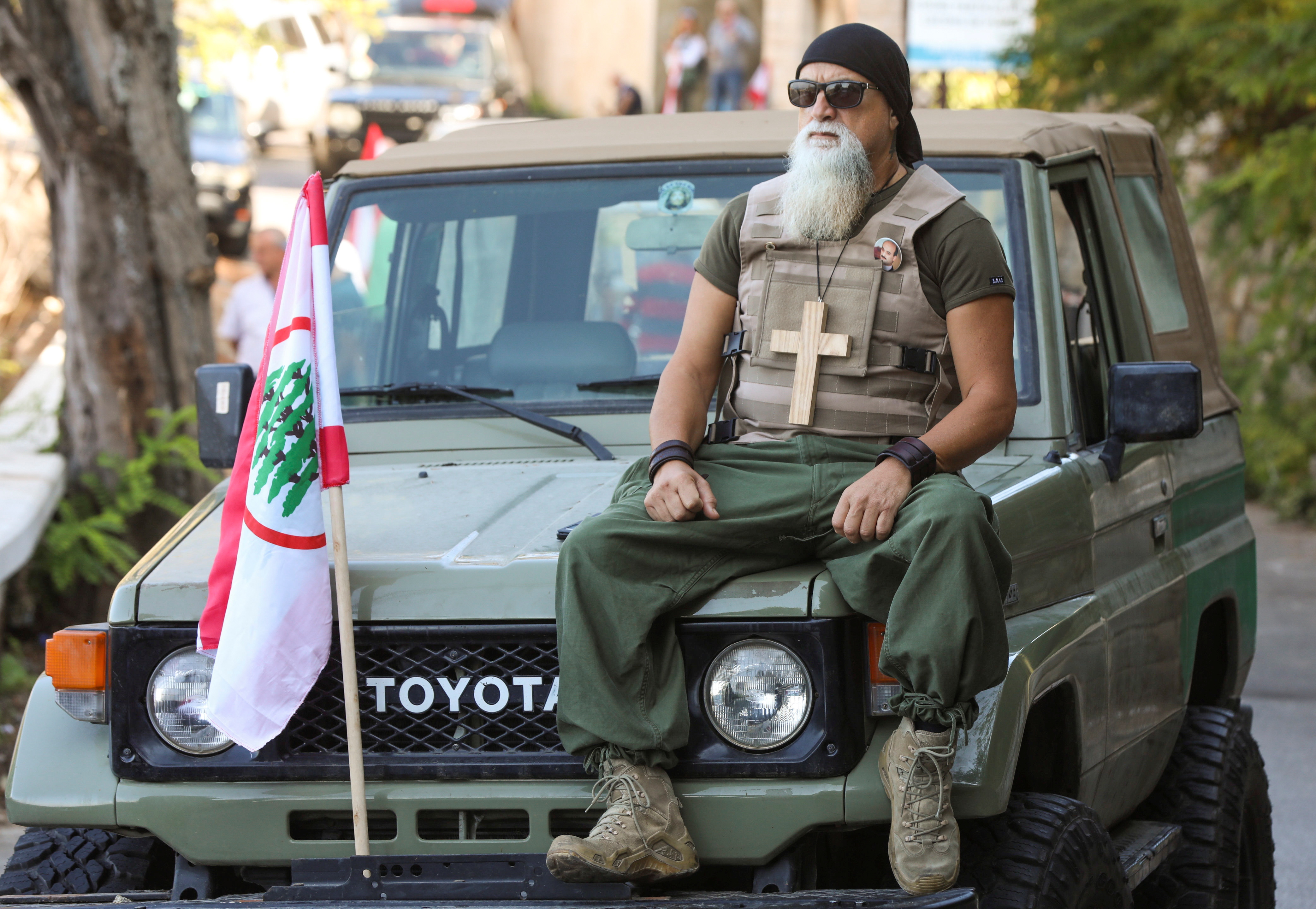 A supporter of the Christian Lebanese Forces party protests against the summoning of party leader Geagea, in Bkerke