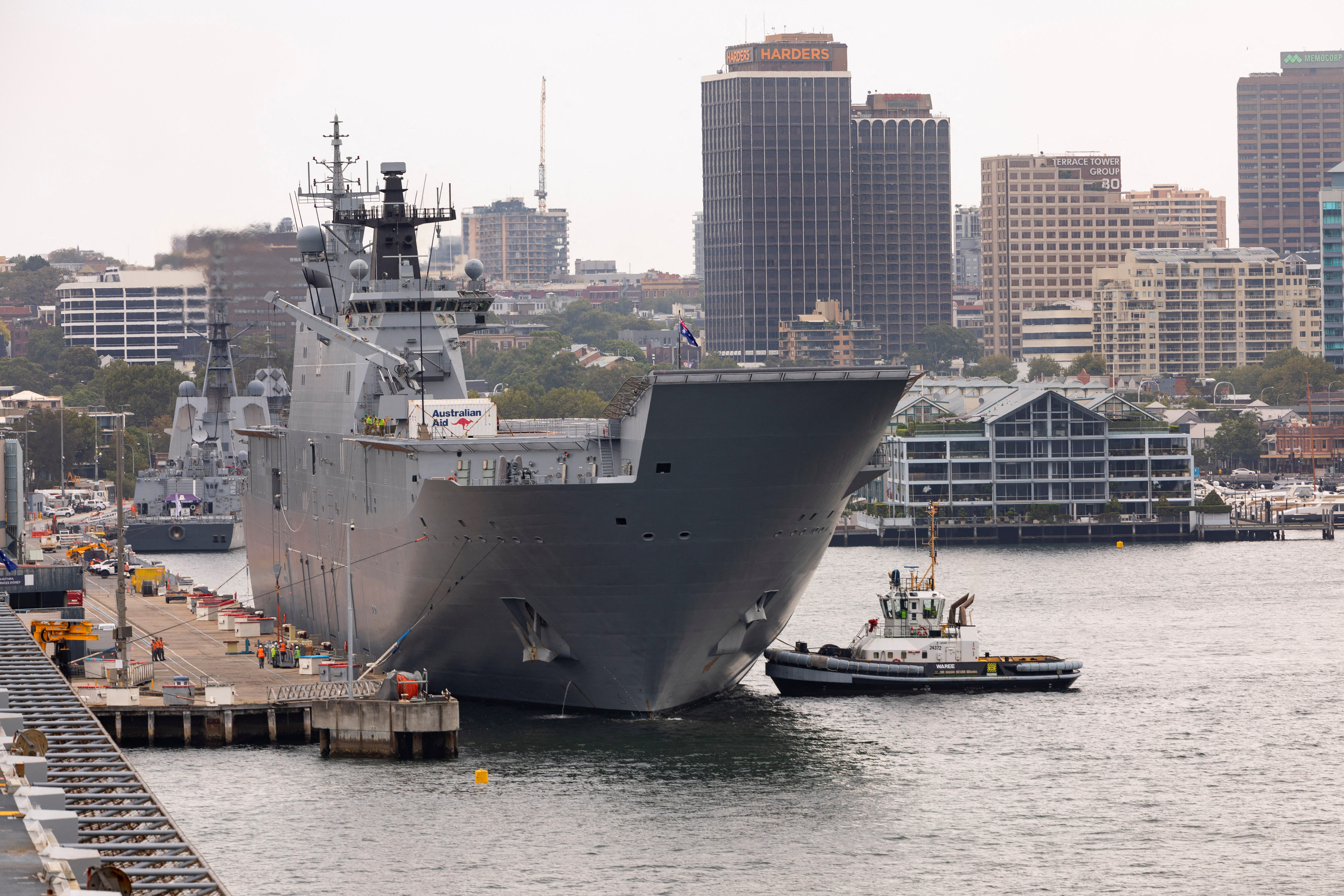 HMAS Adelaide departs Fleet Base East at Garden Island, Sydney, Australia, for Brisbane in preparation to provide disaster relief and assistance to Tonga