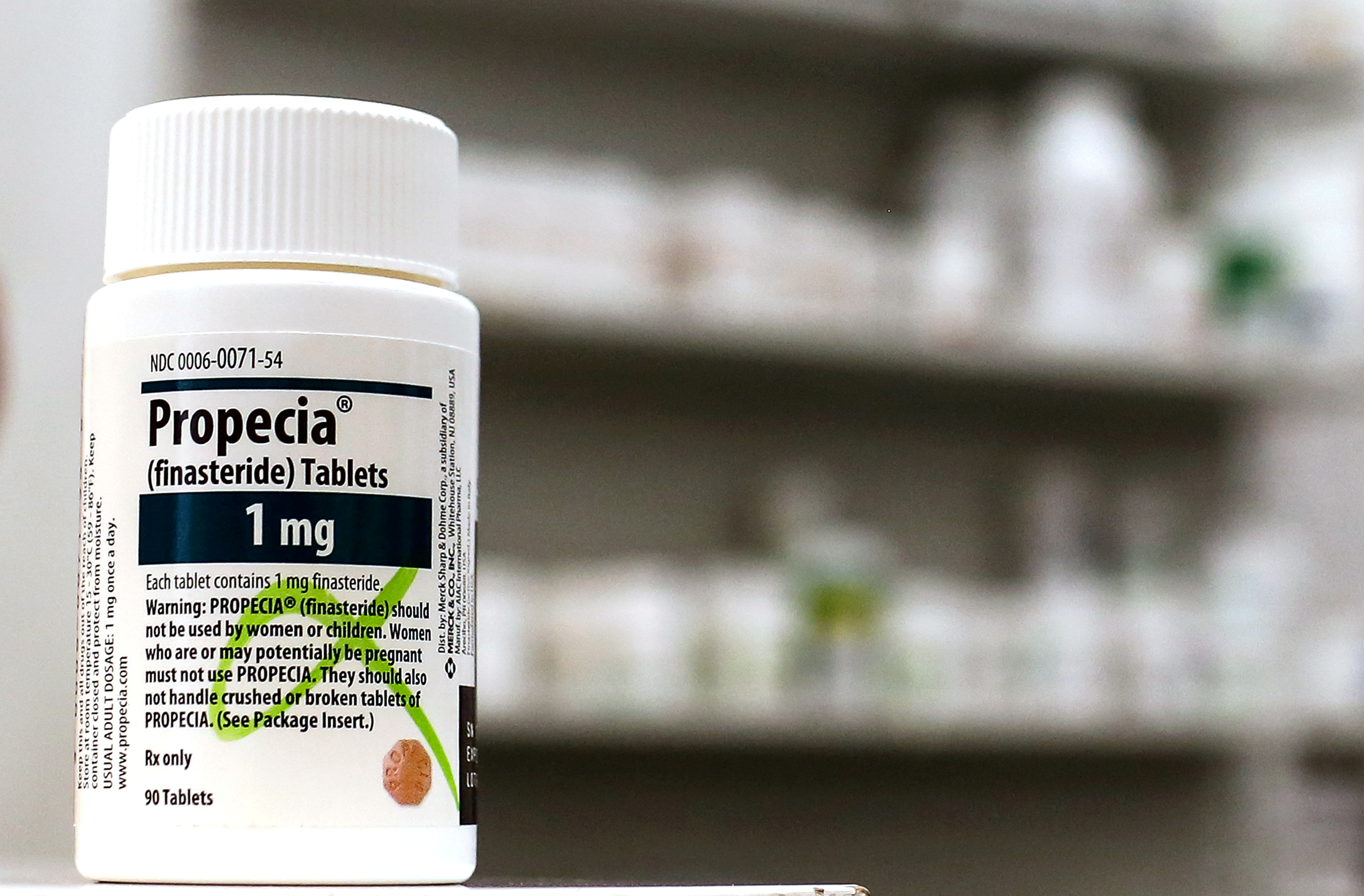 A bottle of Propecia is seen on a pharmacy shelf in New York