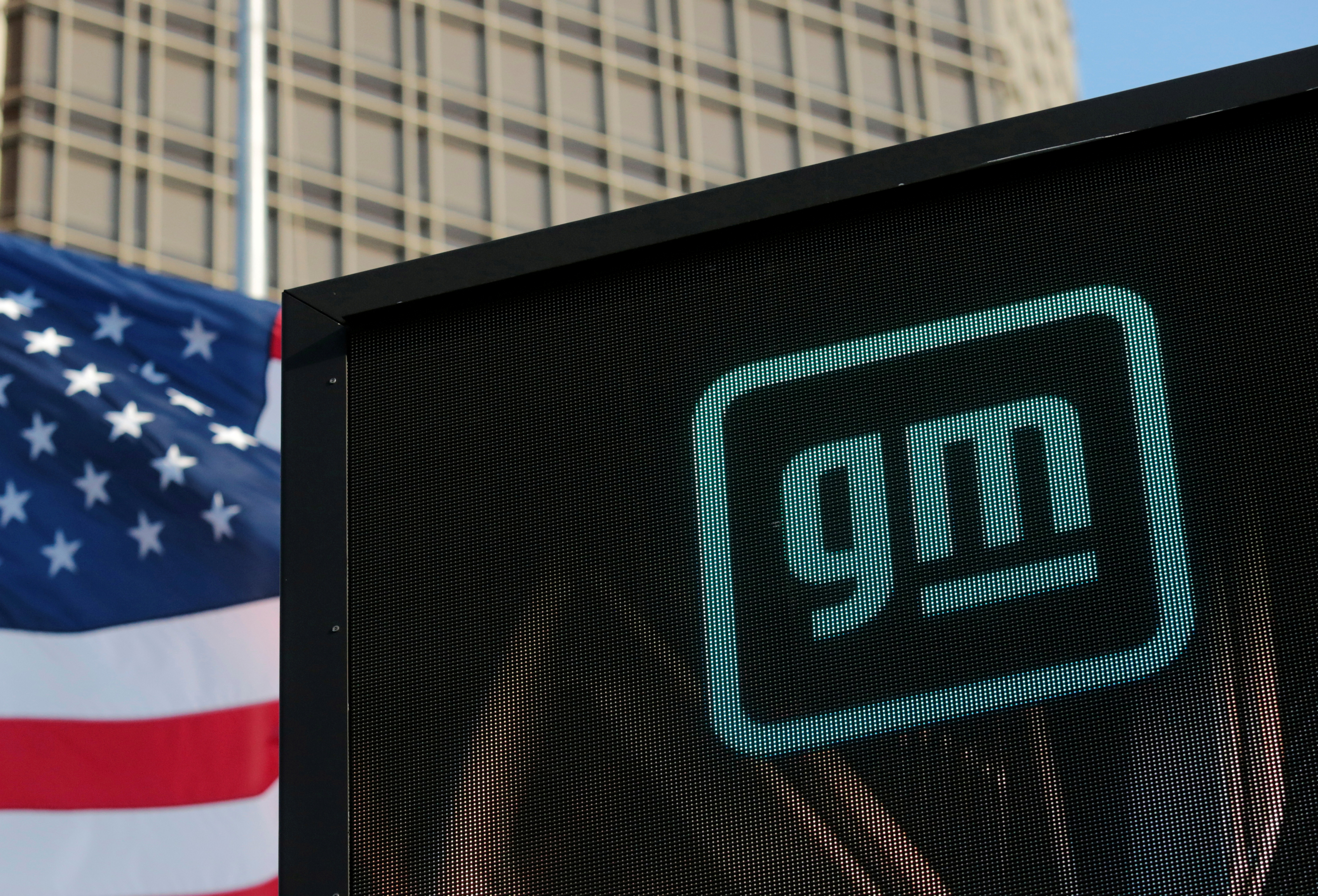 The new GM logo is seen on the facade of the General Motors headquarters in Detroit, Michigan, U.S., March 16, 2021. Picture taken March 16, 2021.  REUTERS/Rebecca Cook/File Photo