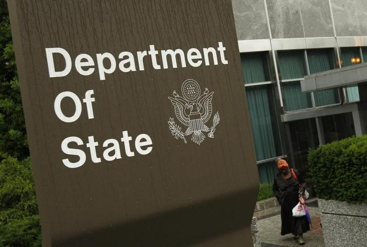 A woman leaves the U.S. State Department building in Washington