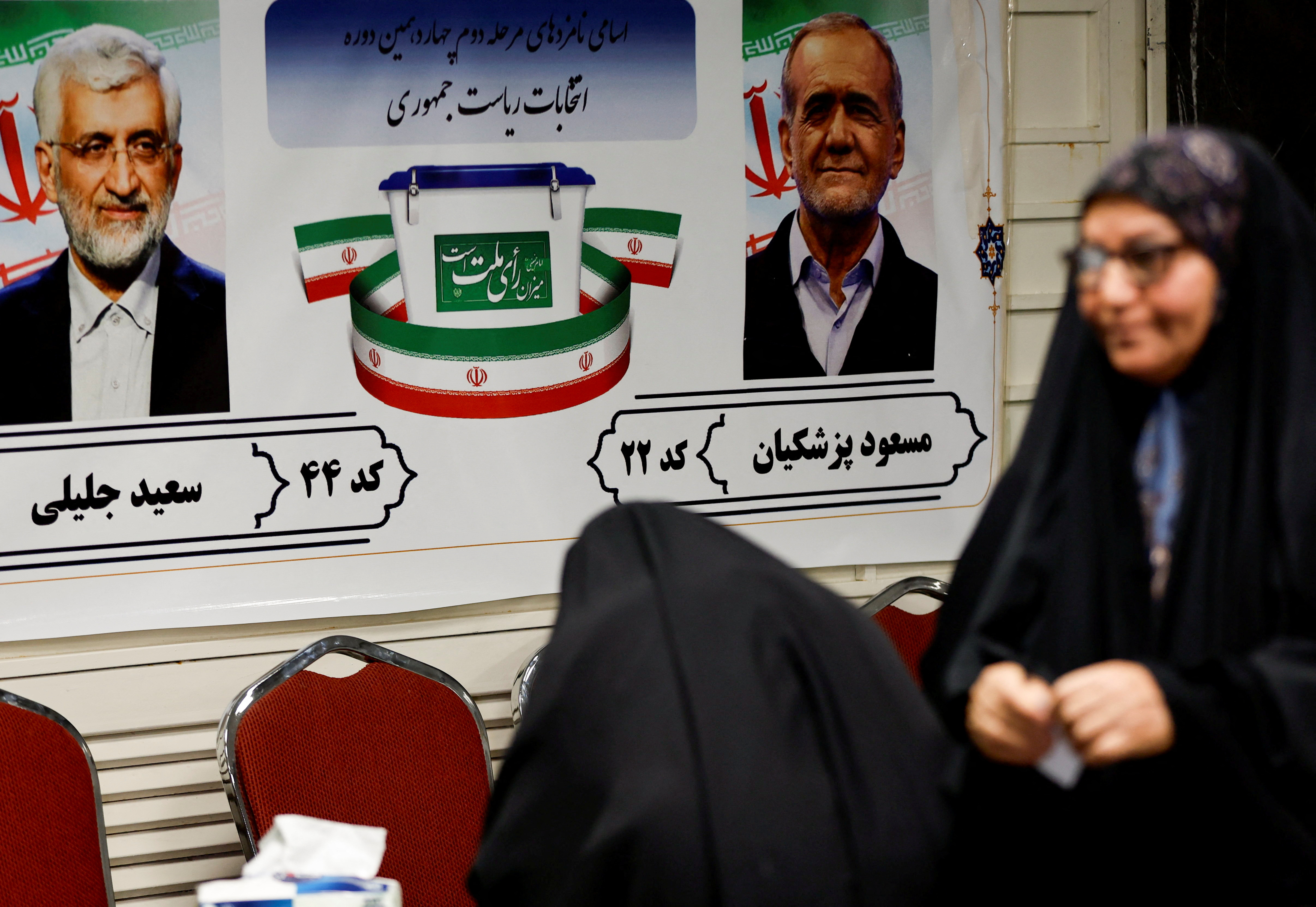 Iranian voters participate in the run-off presidential election between Masoud Pezeshkian and Saeed Jalili,at the Iranian embassy, in Baghdad
