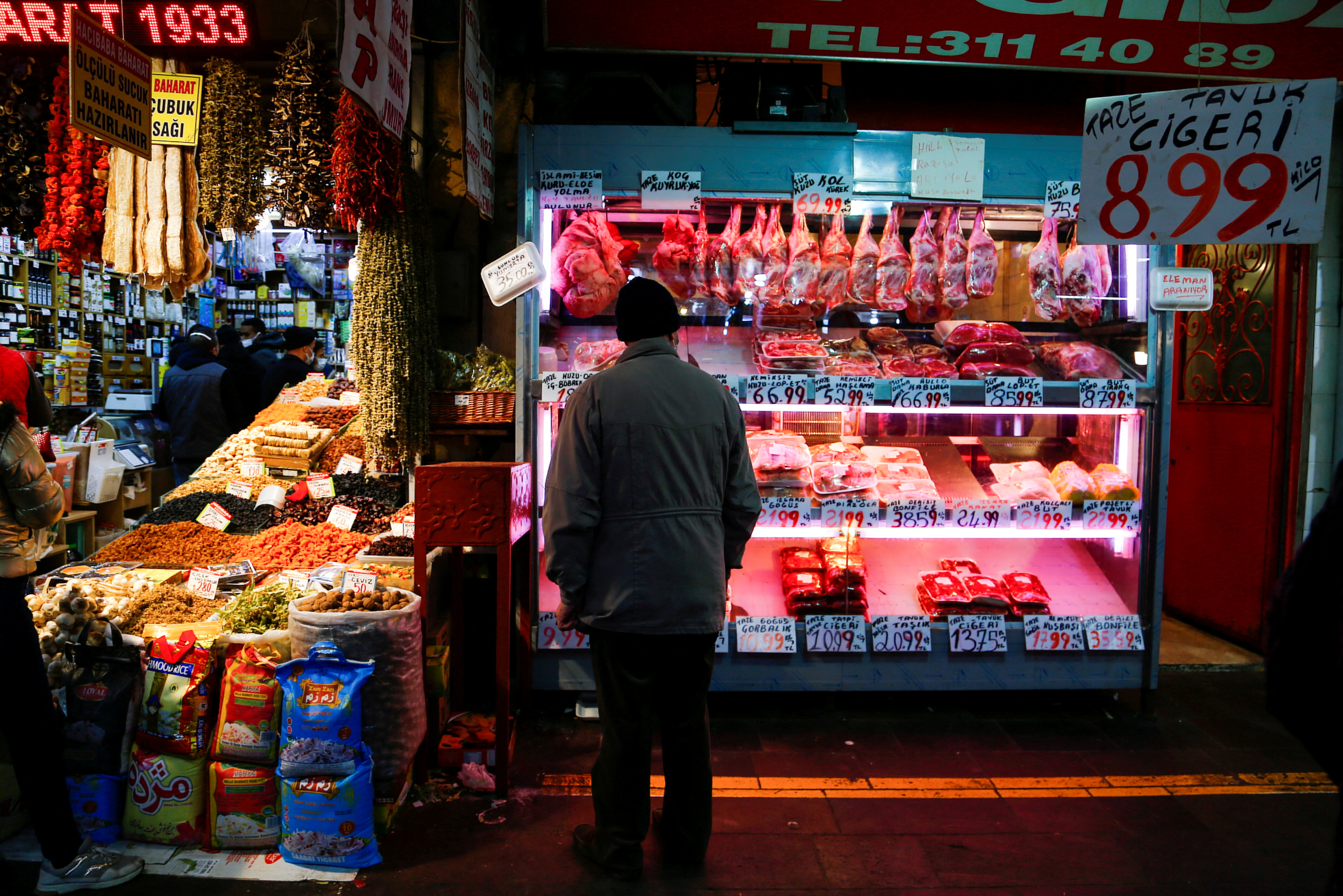 A man looks at a butcher shop window in Ankara