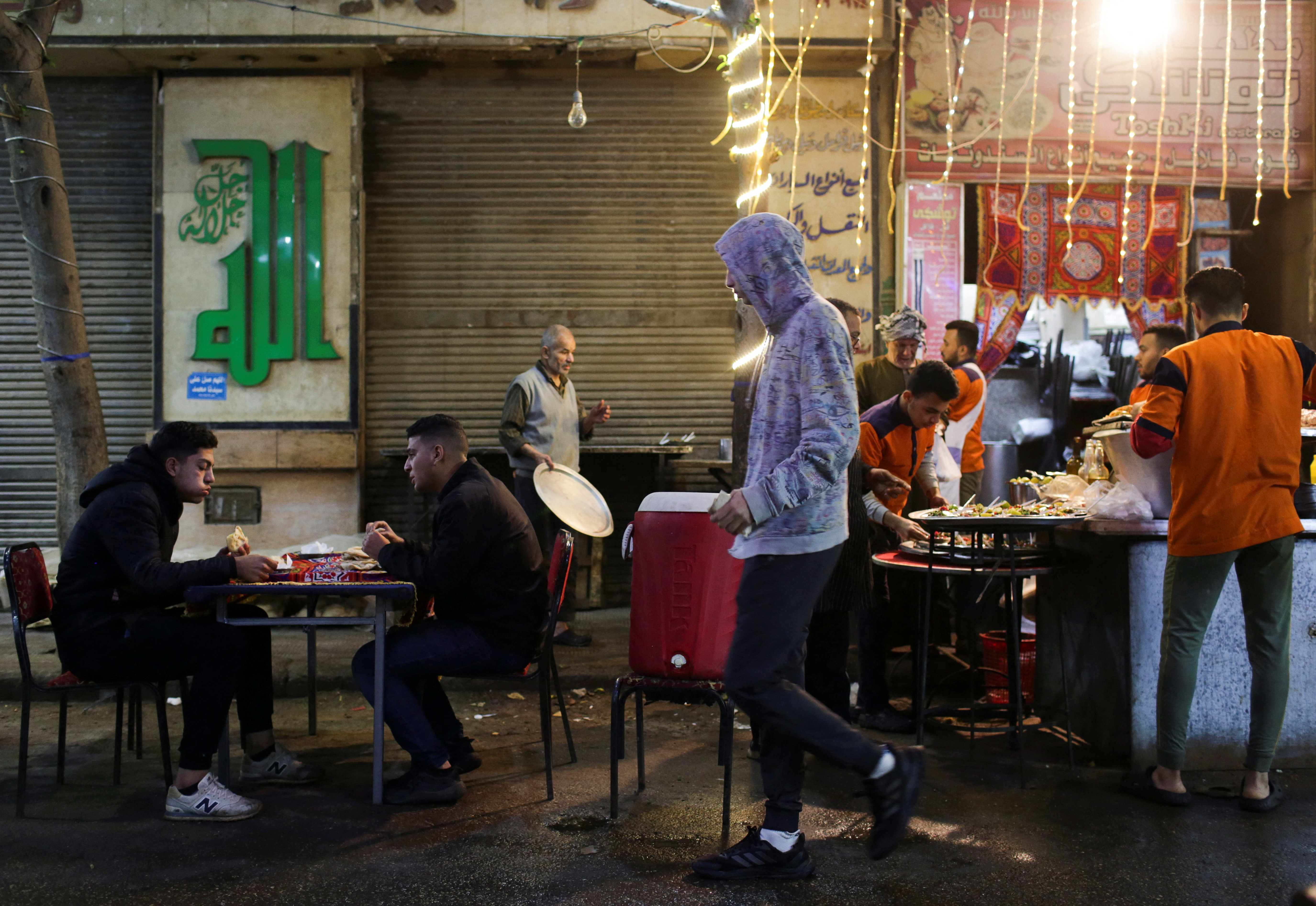People gather to eat Egyptian traditional food "Suhoor" during the holy fasting month of Ramadan in Cairo