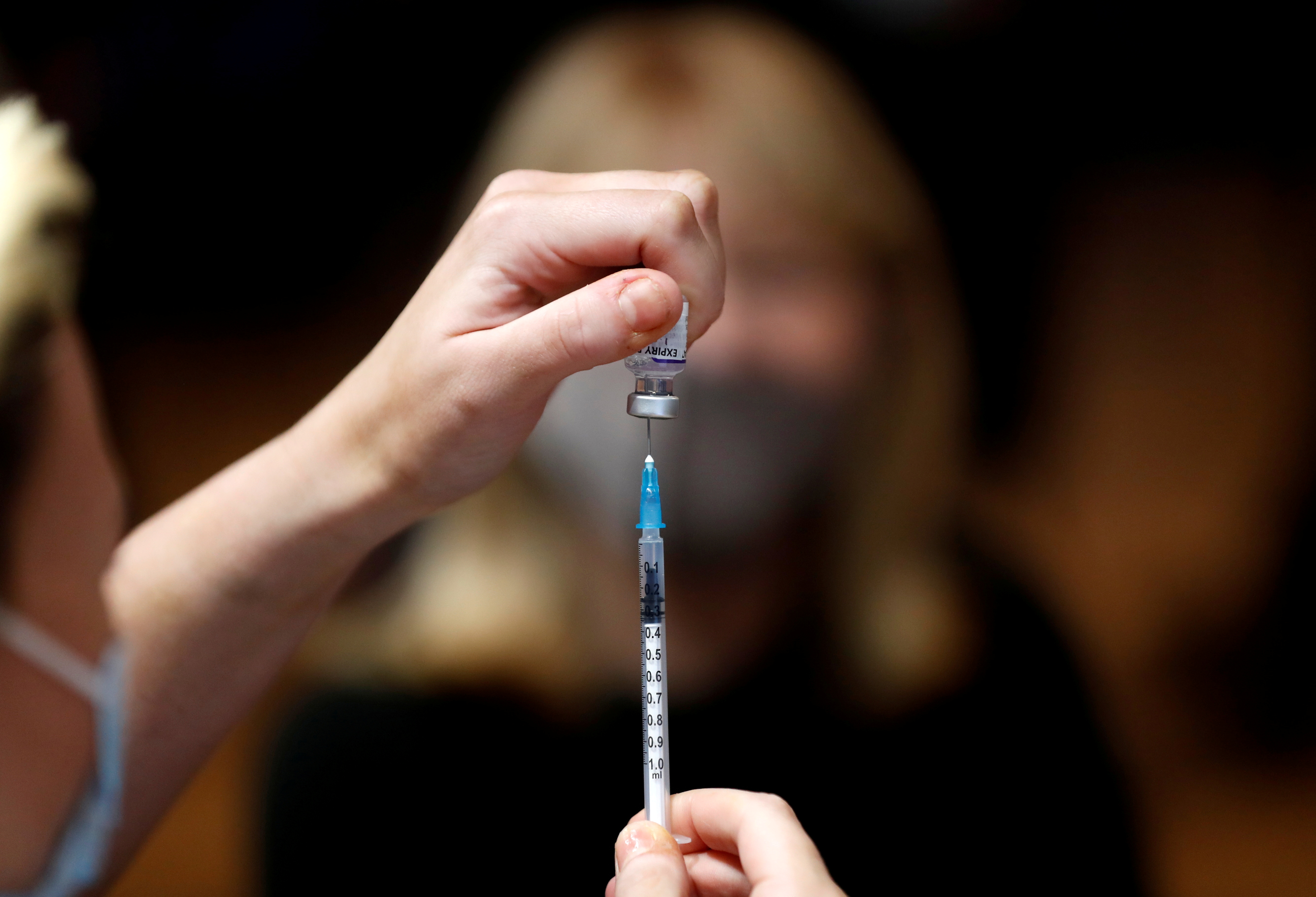 A nurse prepares a vaccination at the Hartlepool Town Hall Theatre vaccination centre, as the spread of the coronavirus disease (COVID-19) continues in Hartlepool, Britain, December 1 2021. REUTERS/Lee Smith