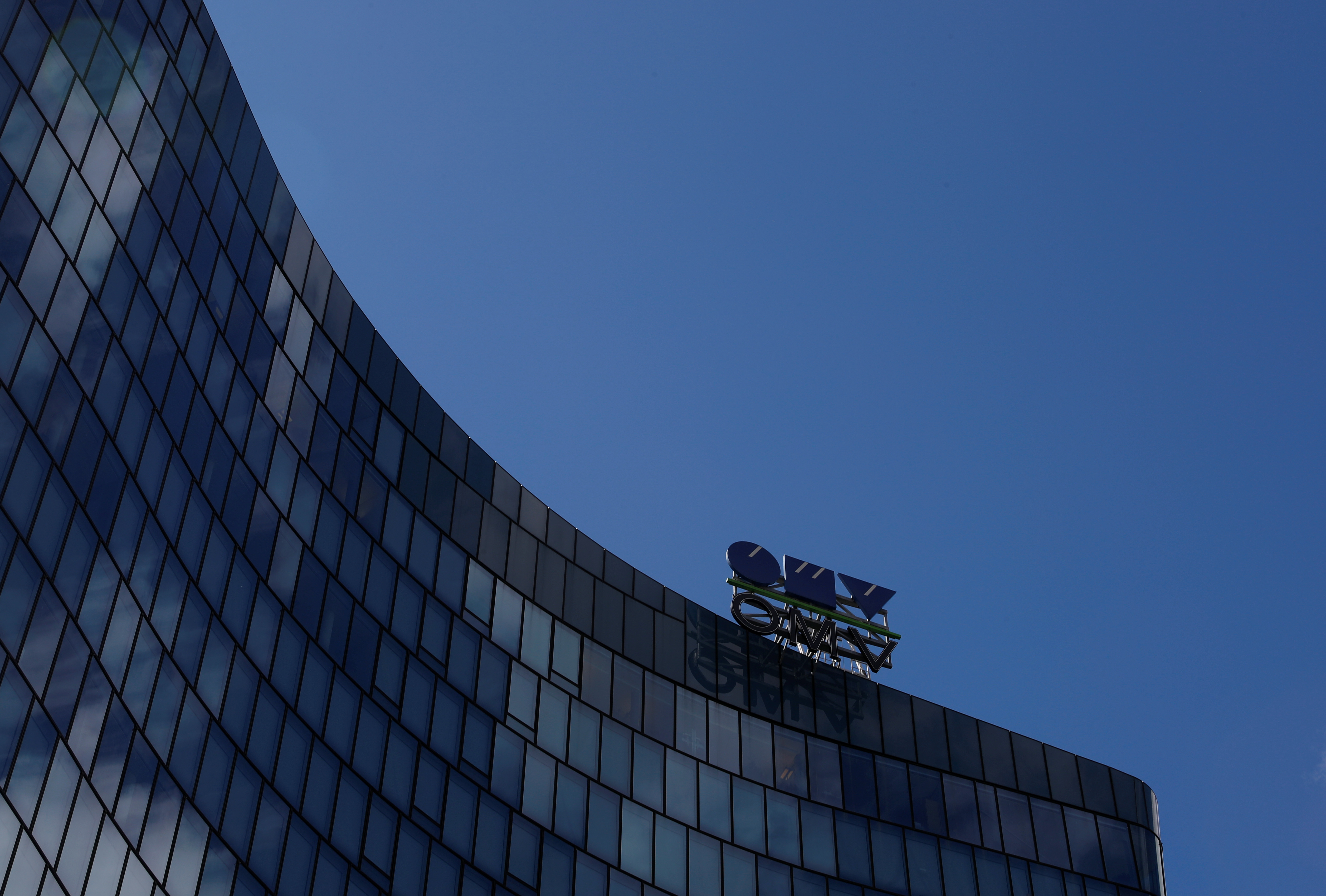 The logo of Austrian oil and gas group OMV is pictured at the rooftop of its headquarters in Vienna