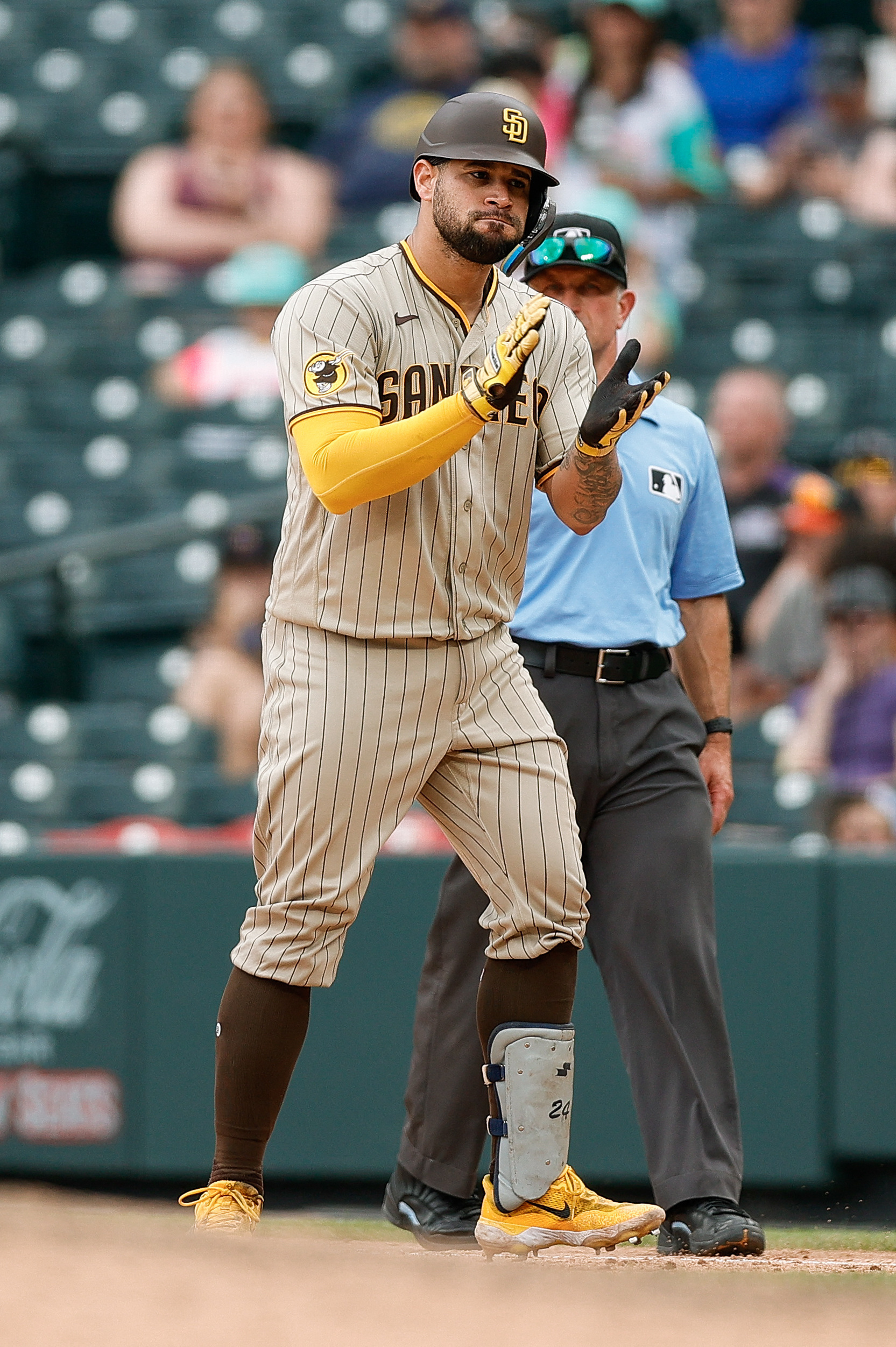 San Diego Padres' Ha-Seong Kim, left, talks with Xander Bogaerts walking  off the infield during warmups before a baseball game against the Colorado  Rockies in San Diego, Friday, March 31, 2023. (AP