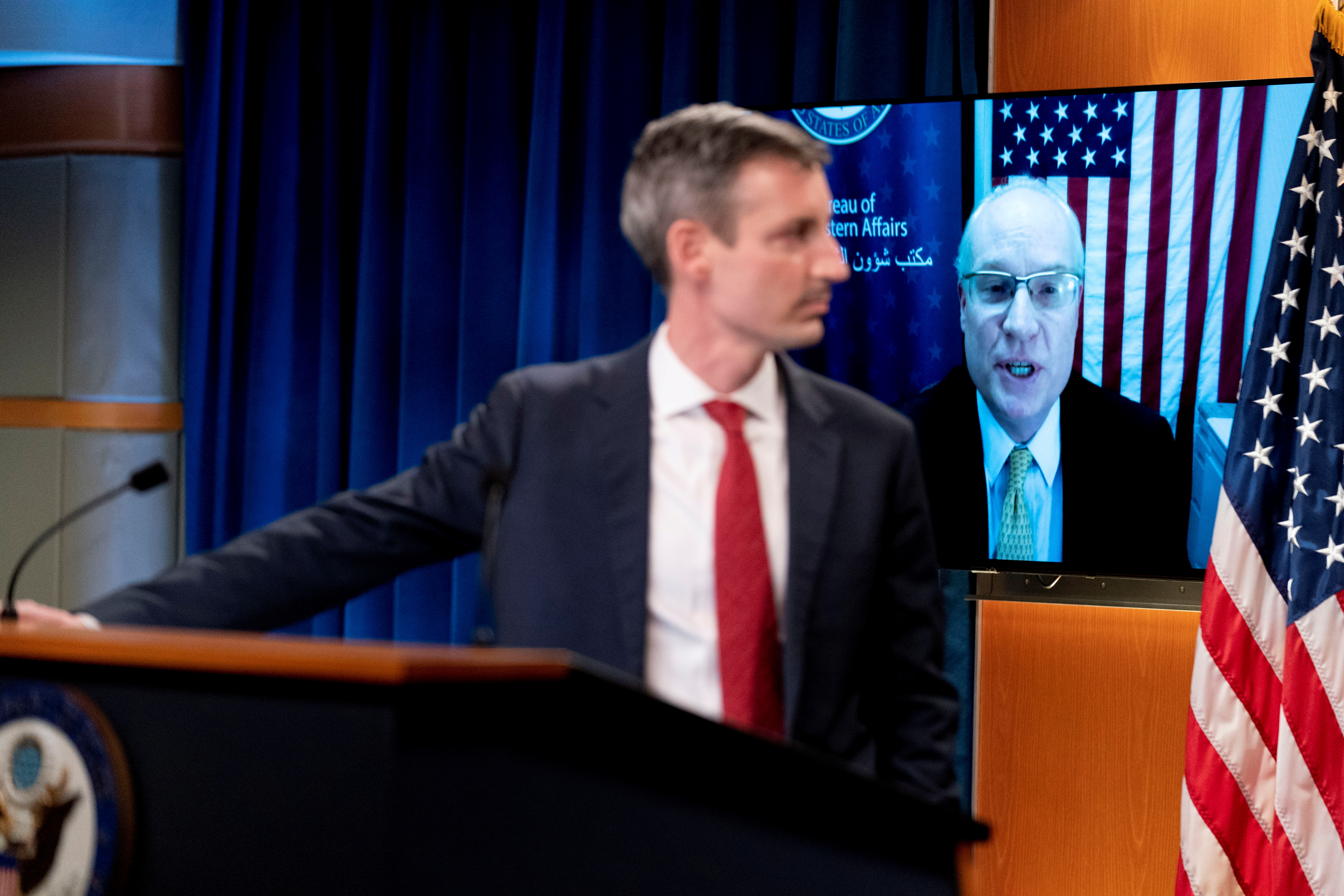 U.S. Special Envoy for Yemen Timothy Lenderking, accompanied by State Department spokesman Ned Price, left, speaks via teleconference during a news conference at the State Department in Washington, U.S., February 16, 2021. Andrew Harnik/Pool via REUTERS/File Photo