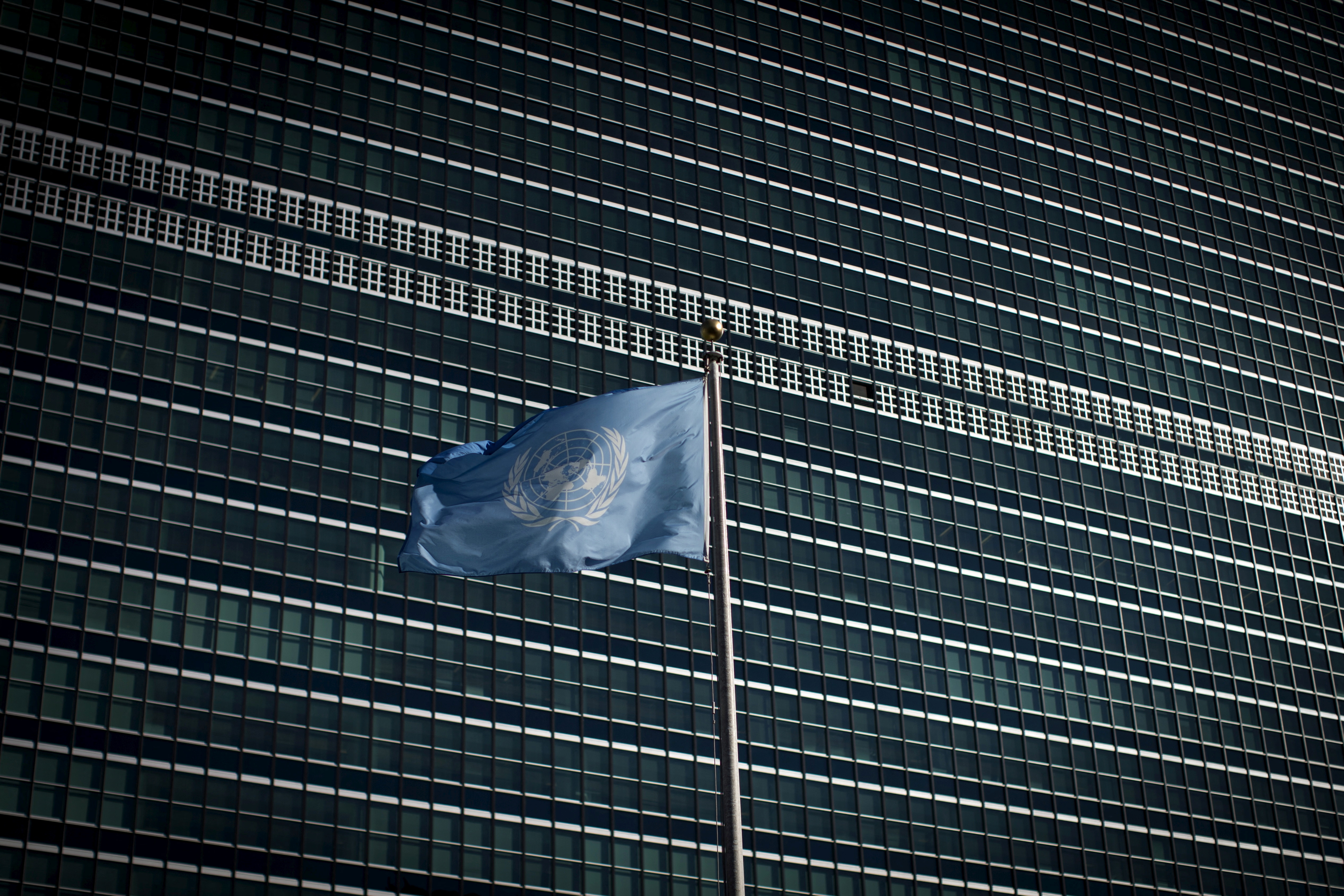 The United Nations flag flies in front of the Secretariat Building at the United Nations headquarters in New York City
