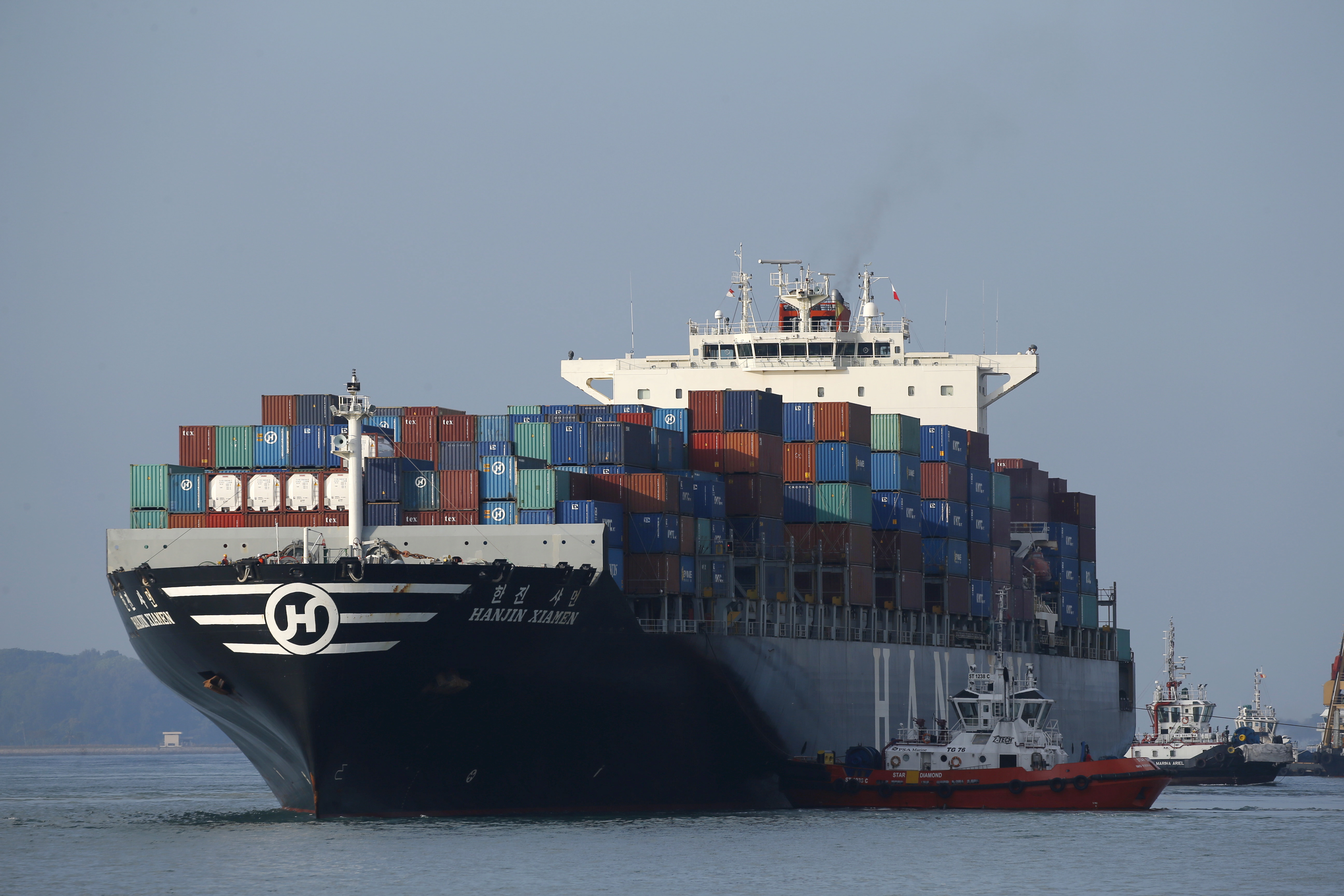 A ship prepares to dock at PSA's Tanjong Pagar container port in Singapore