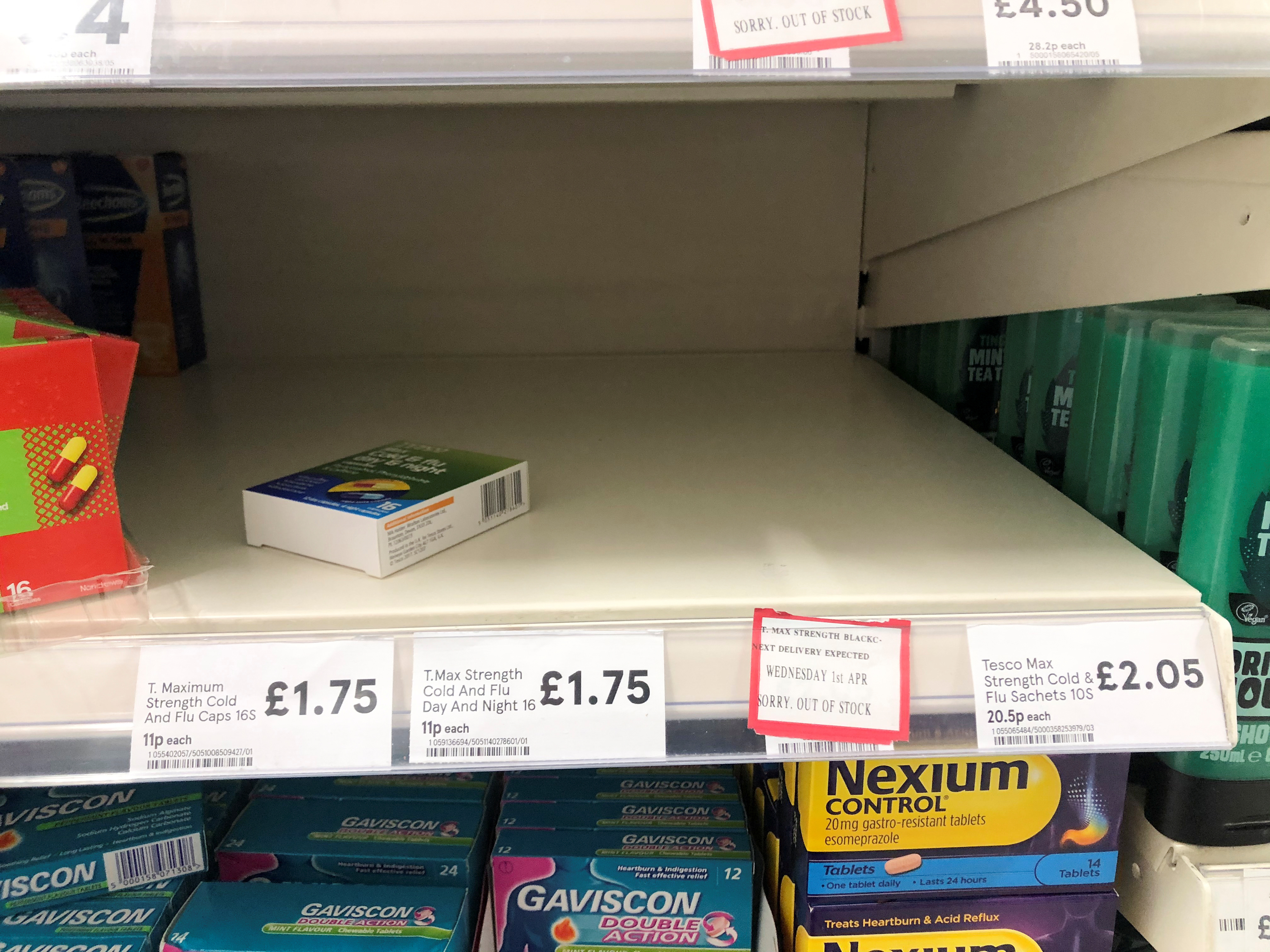 An empty shelf out of stock of medicine are pictured in a supermarket in London
