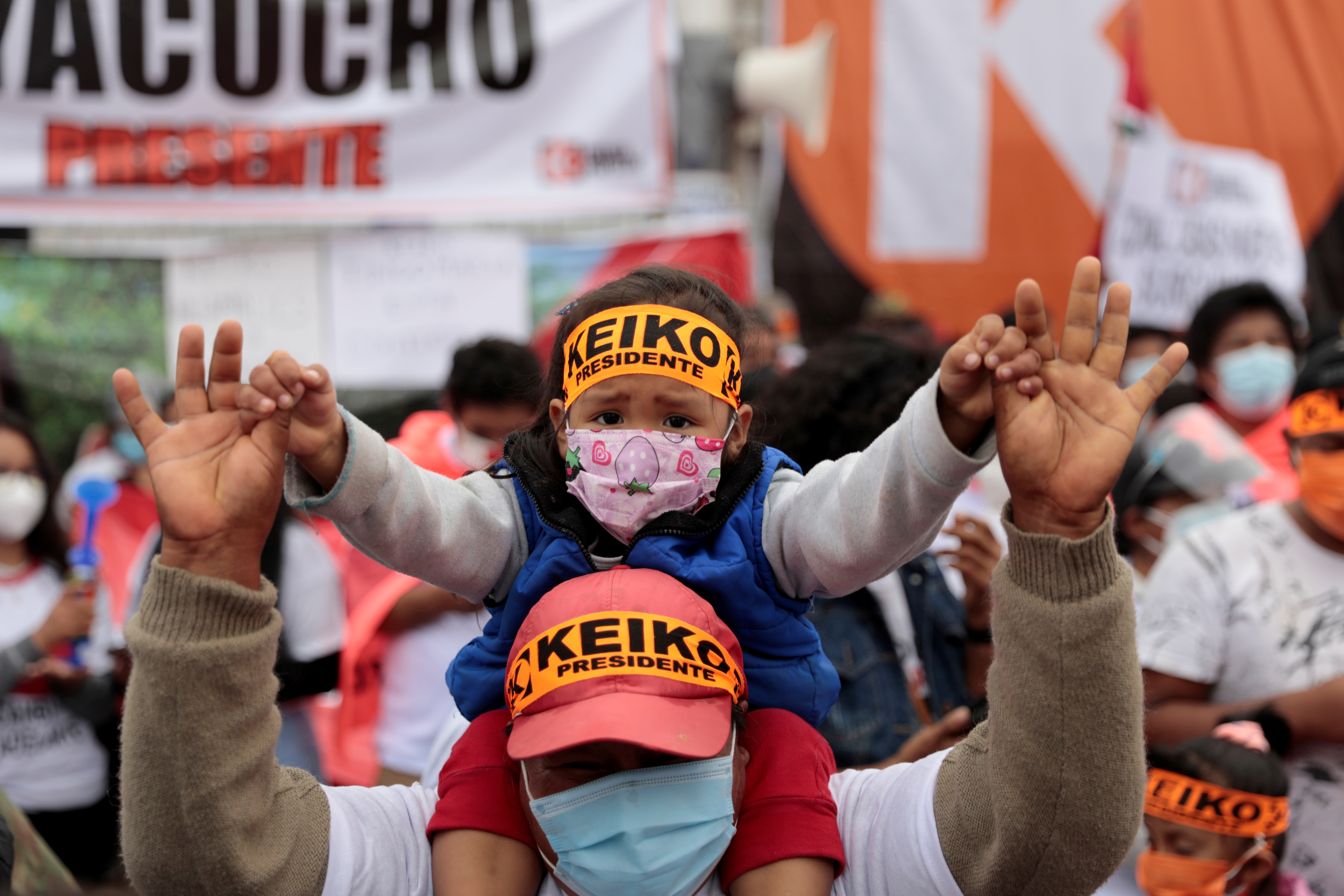 Supporters of Peru's right-wing candidate Keiko Fujimori, who will face opponent socialist candidate Pedro Castillo in a run-off vote on June 6, attend a political rally, in Lima, Peru May 15, 2021. REUTERS/Alessandro Cinque    