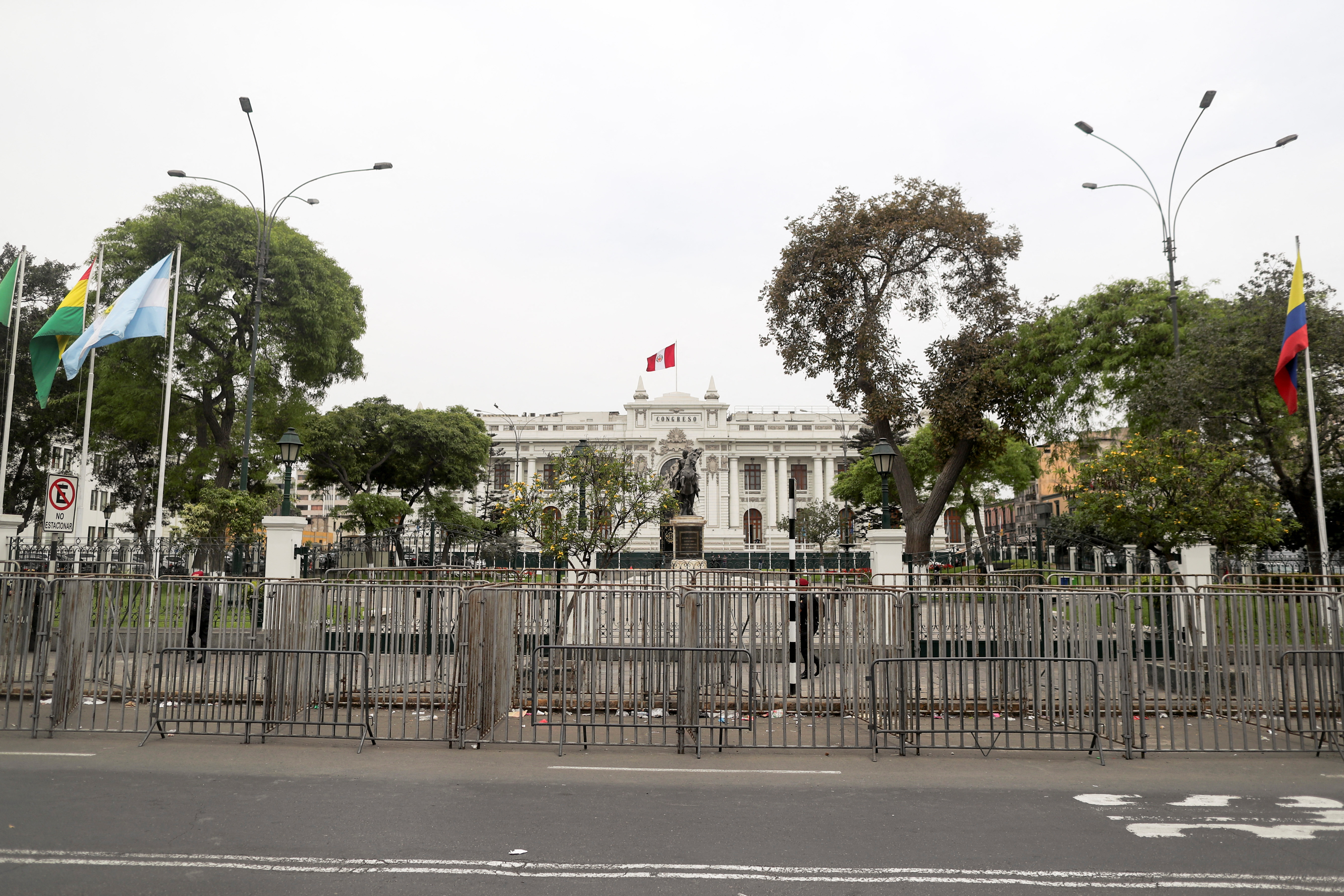People gather outside Peru's Congress after President Pedro Castillo said he will dissolve Congress in Lima