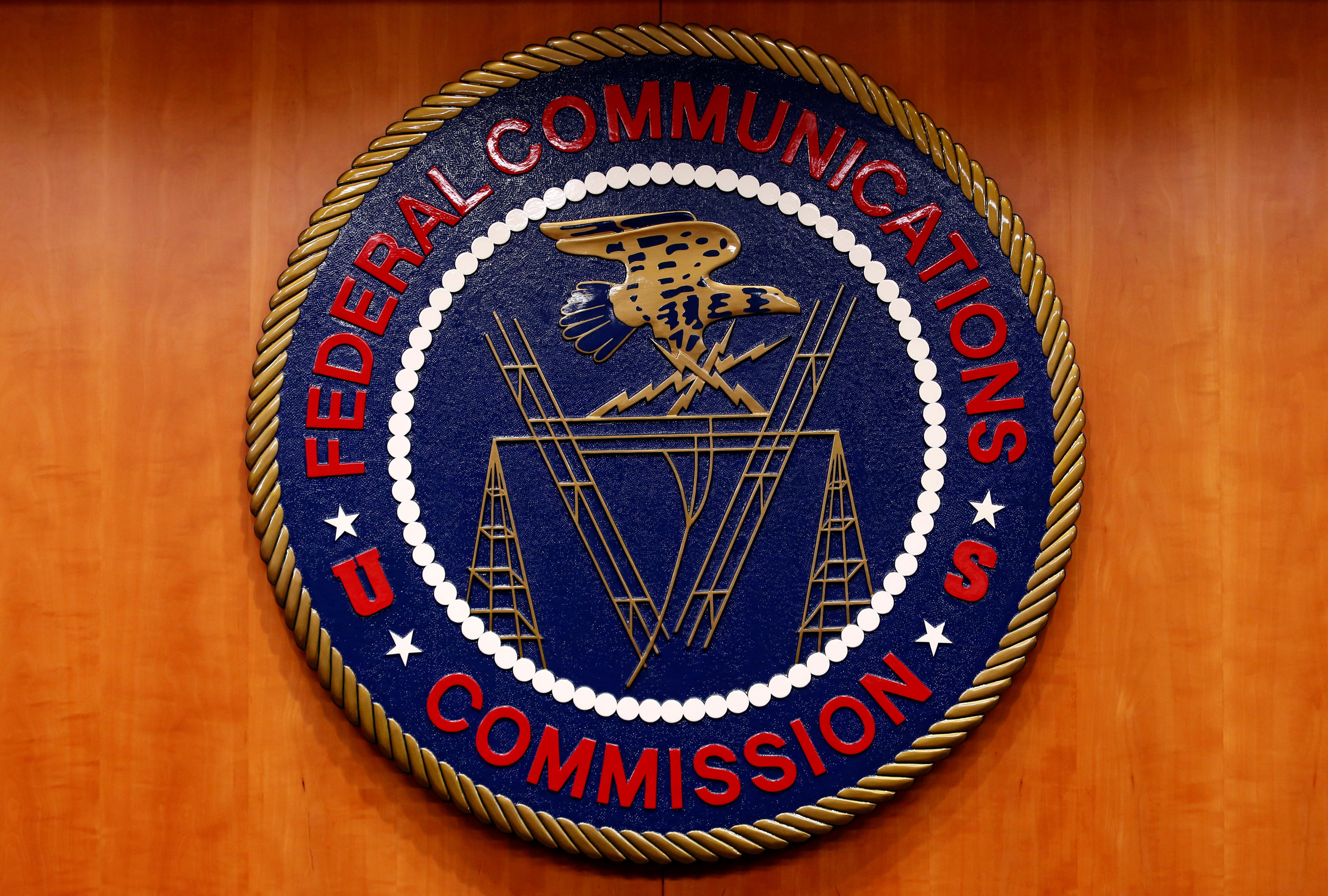 The Federal Communications Commission (FCC) logo is seen before the FCC Net Neutrality hearing in Washington