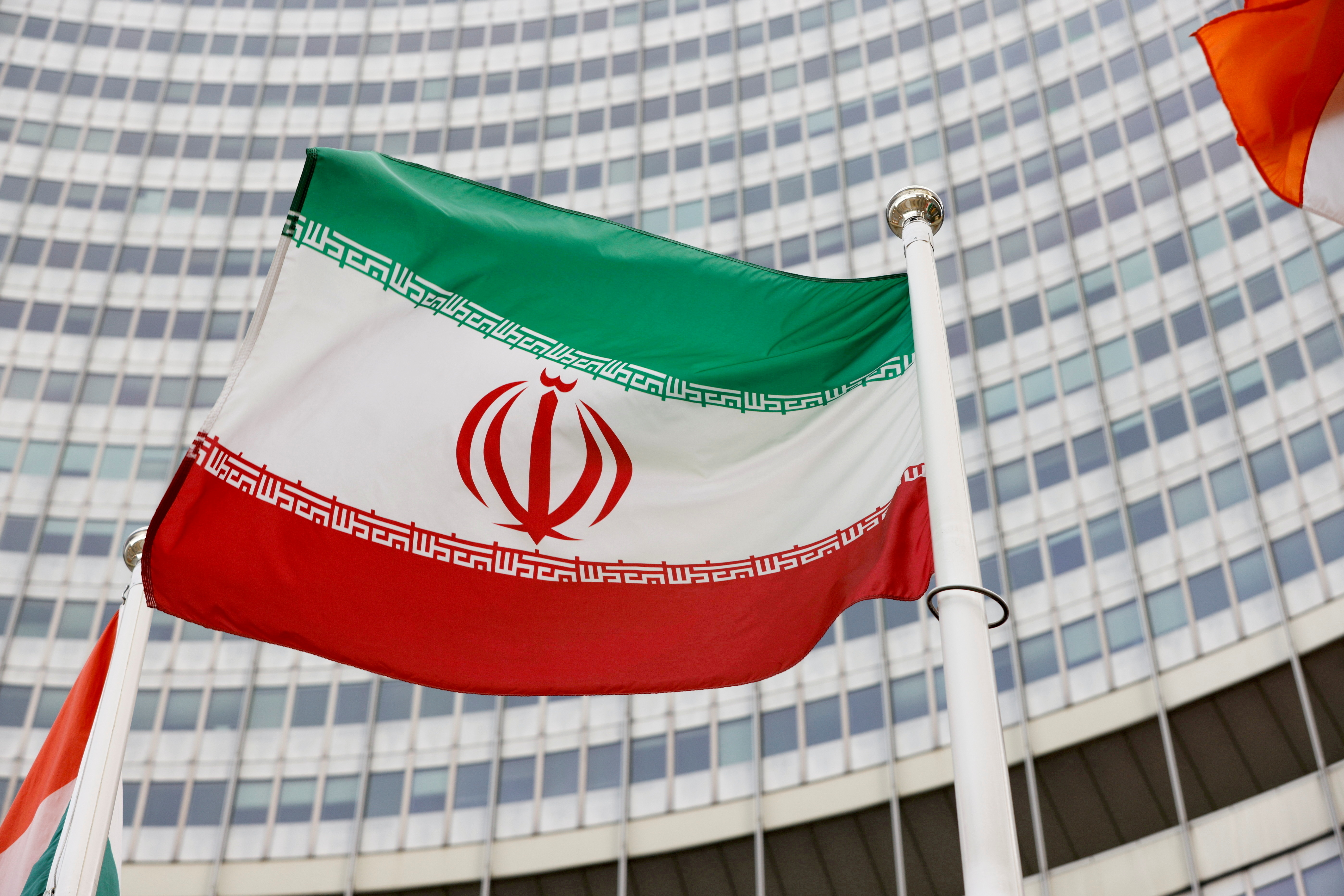 The Iranian flag waves in front of the International Atomic Energy Agency (IAEA) headquarters in Vienna, Austria May 23, 2021. REUTERS/Leonhard Foeger/File Photo