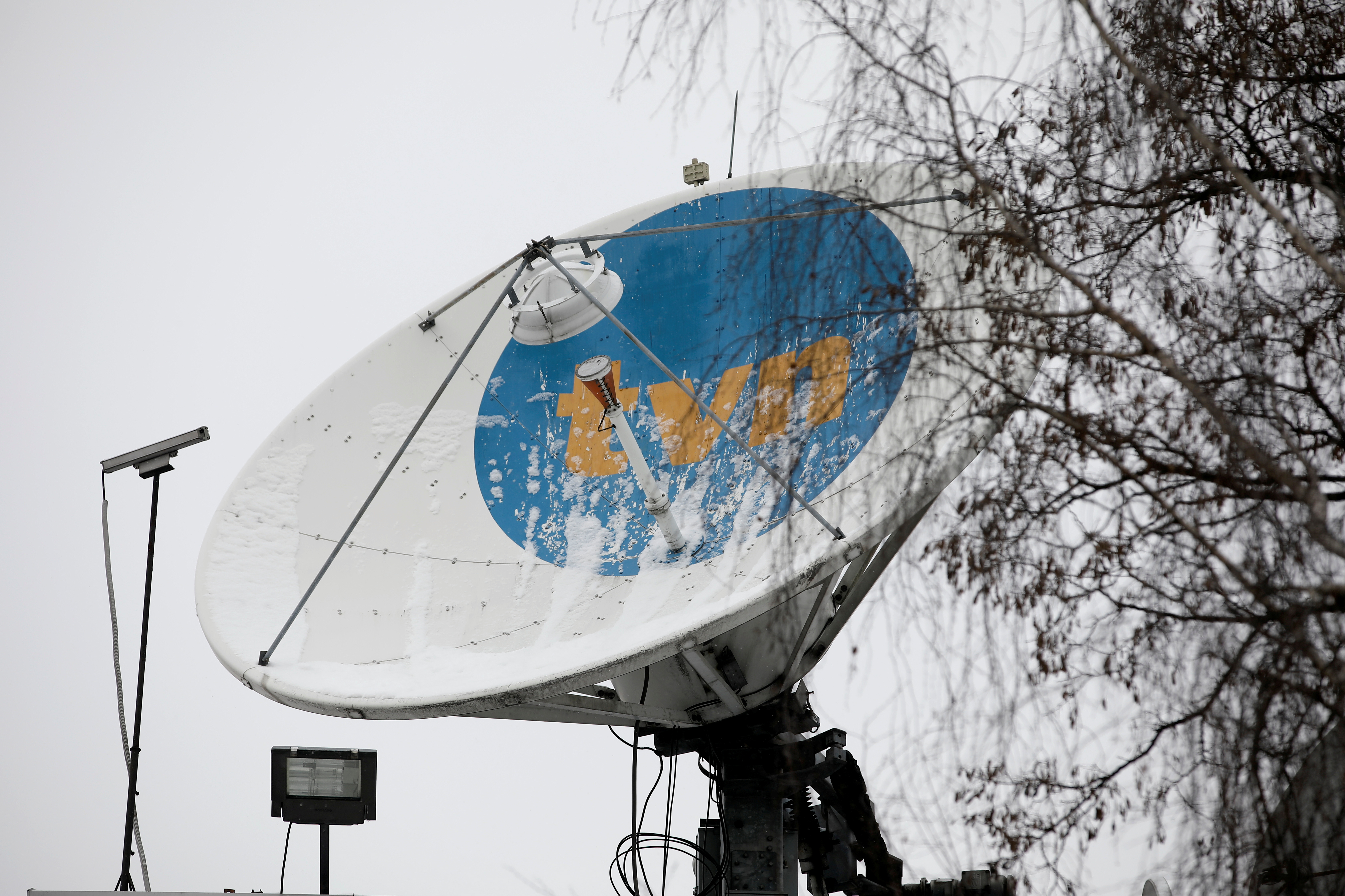 Private television TVN logo is see on satellite antenna at their headquarters in Warsaw