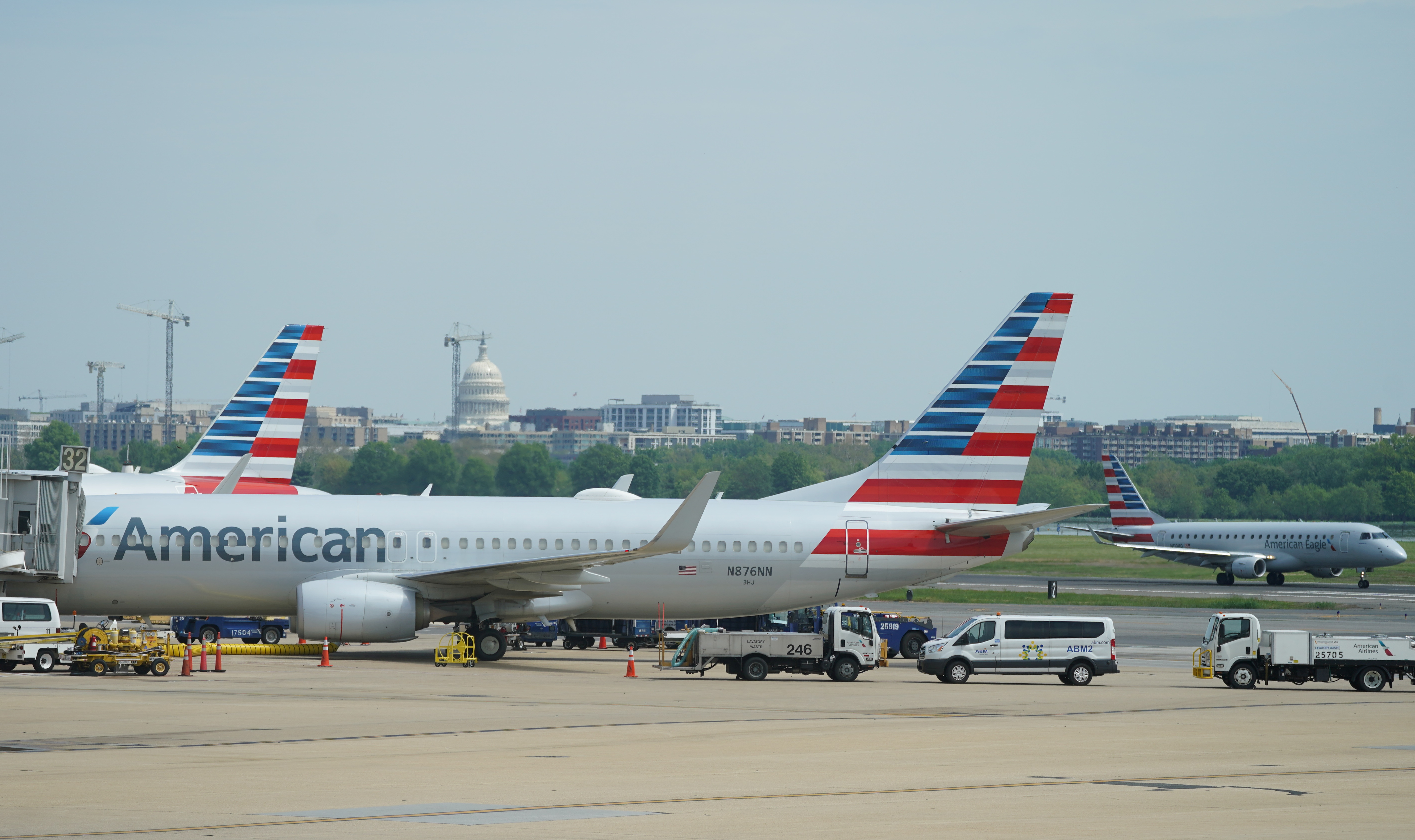 Boeing 737 jet sits at a gate at Washington's Reagan National airport with U.S. Capitol building in the background in Washington