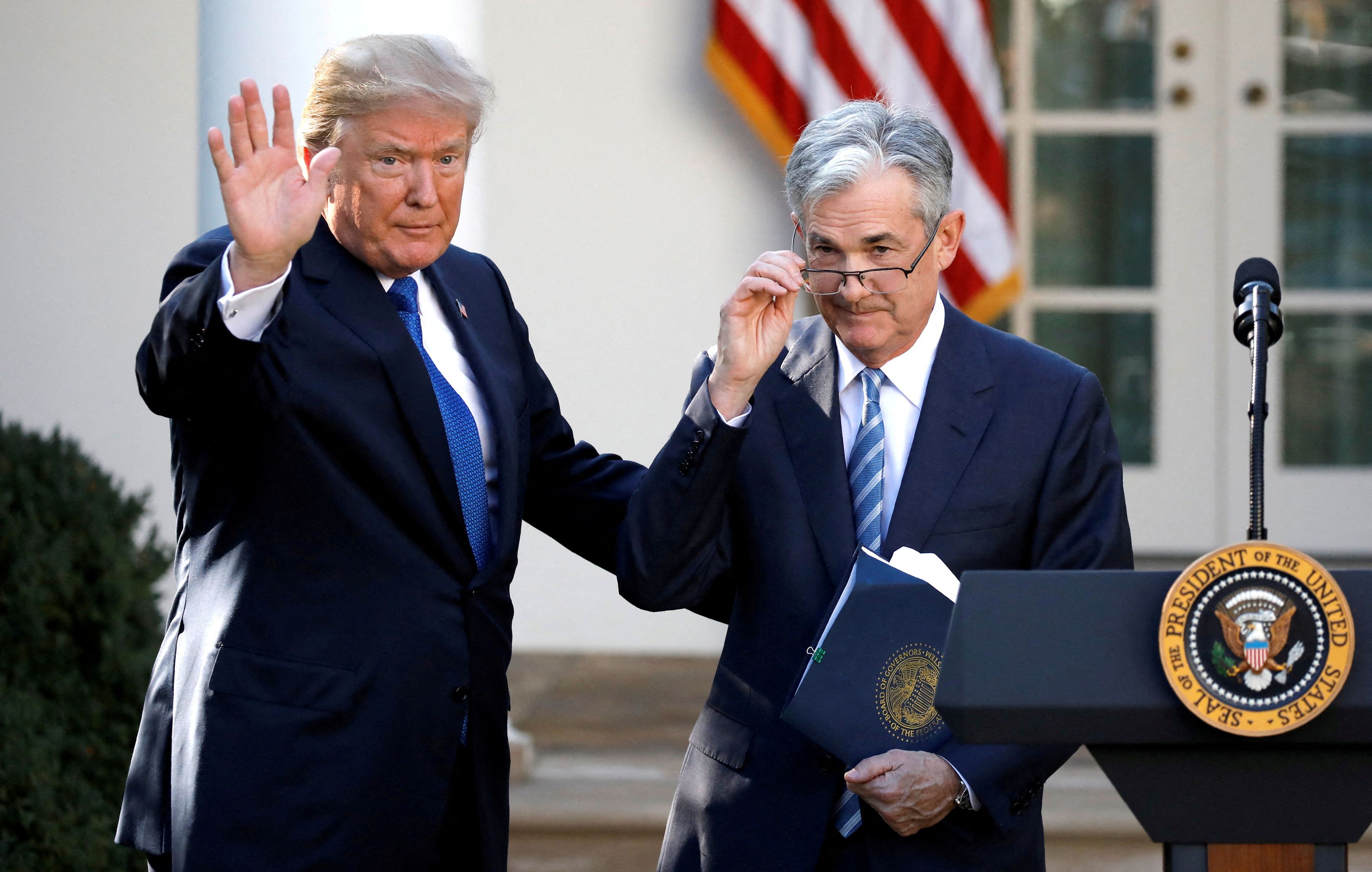 Then-U.S. President Donald Trump gestures with Jerome Powell, his nominee to become chair of the U.S. Federal Reserve at the White House in Washington, U.S., November 2, 2017. REUTERS/Carlos Barria/File Photo